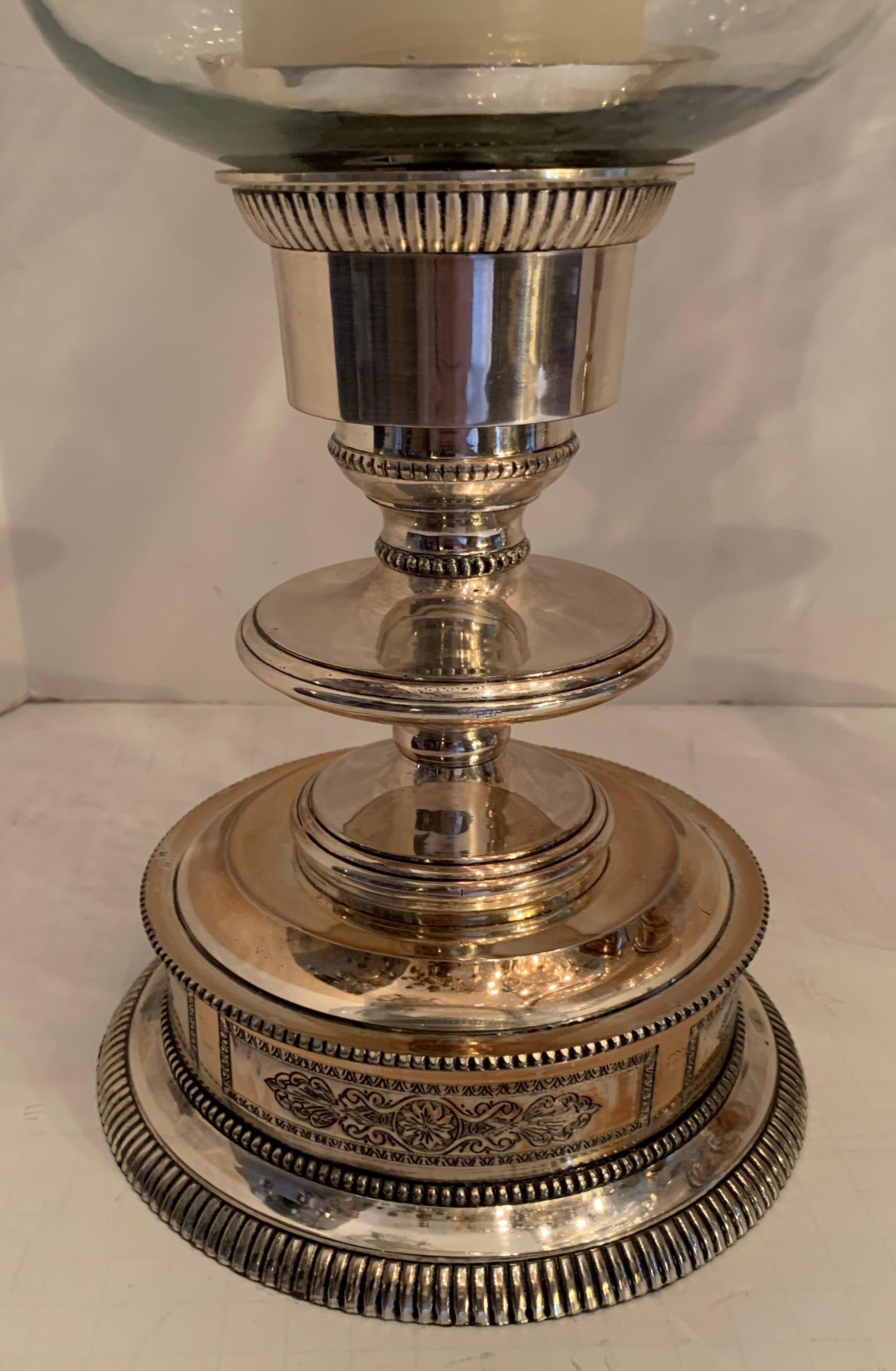 A wonderful large pair of regency Sheffield style etched silver plate photophore hurricane glass cardholders / candlesticks, having tubular clear blown glass shade and finished on the top with a ribbed silver plated rim.
Measures: Height to top rim