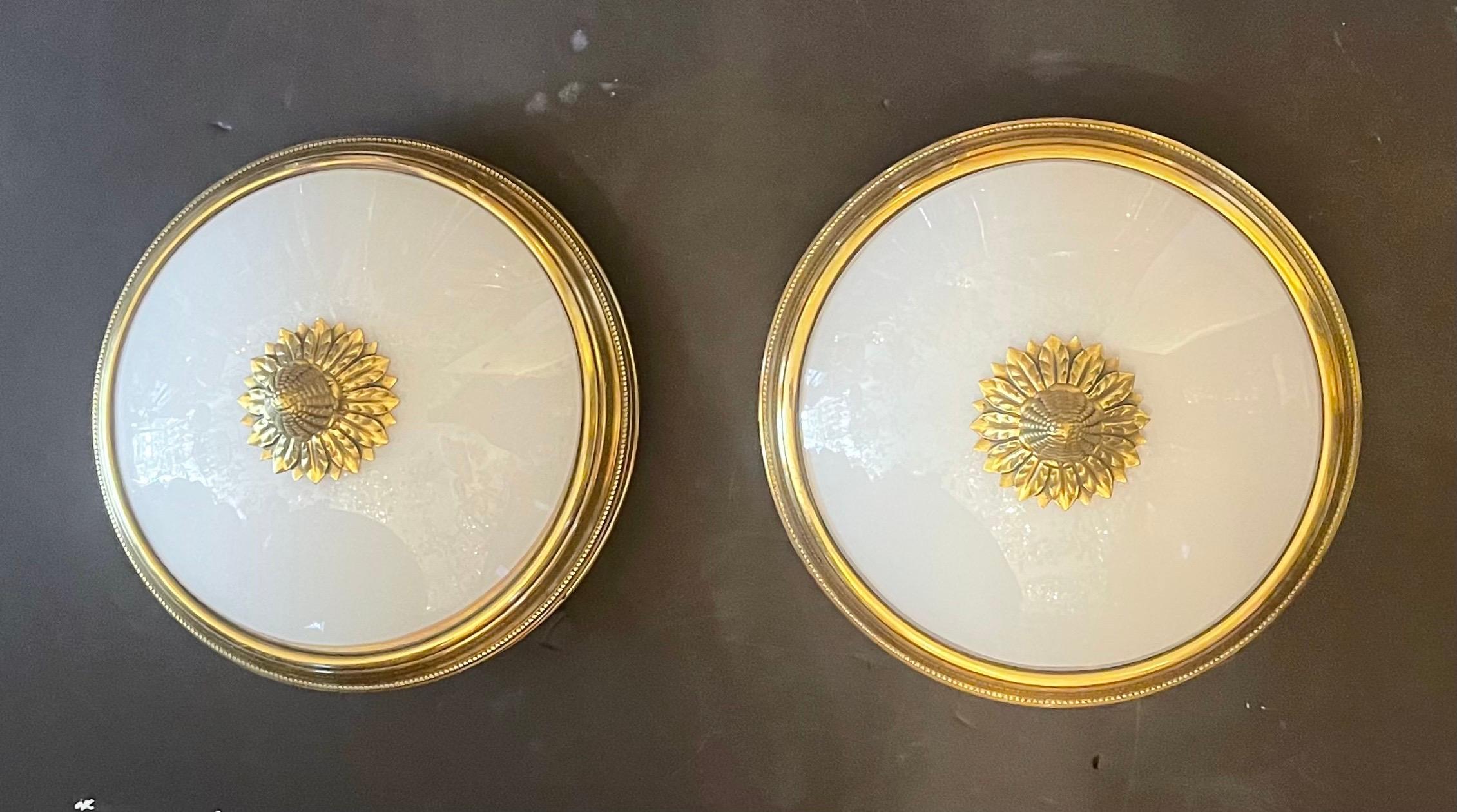 A wonderful pair of Sherle Wagner style polished brass & white milk glass regency flush mount light fixtures.

Each sold separately.