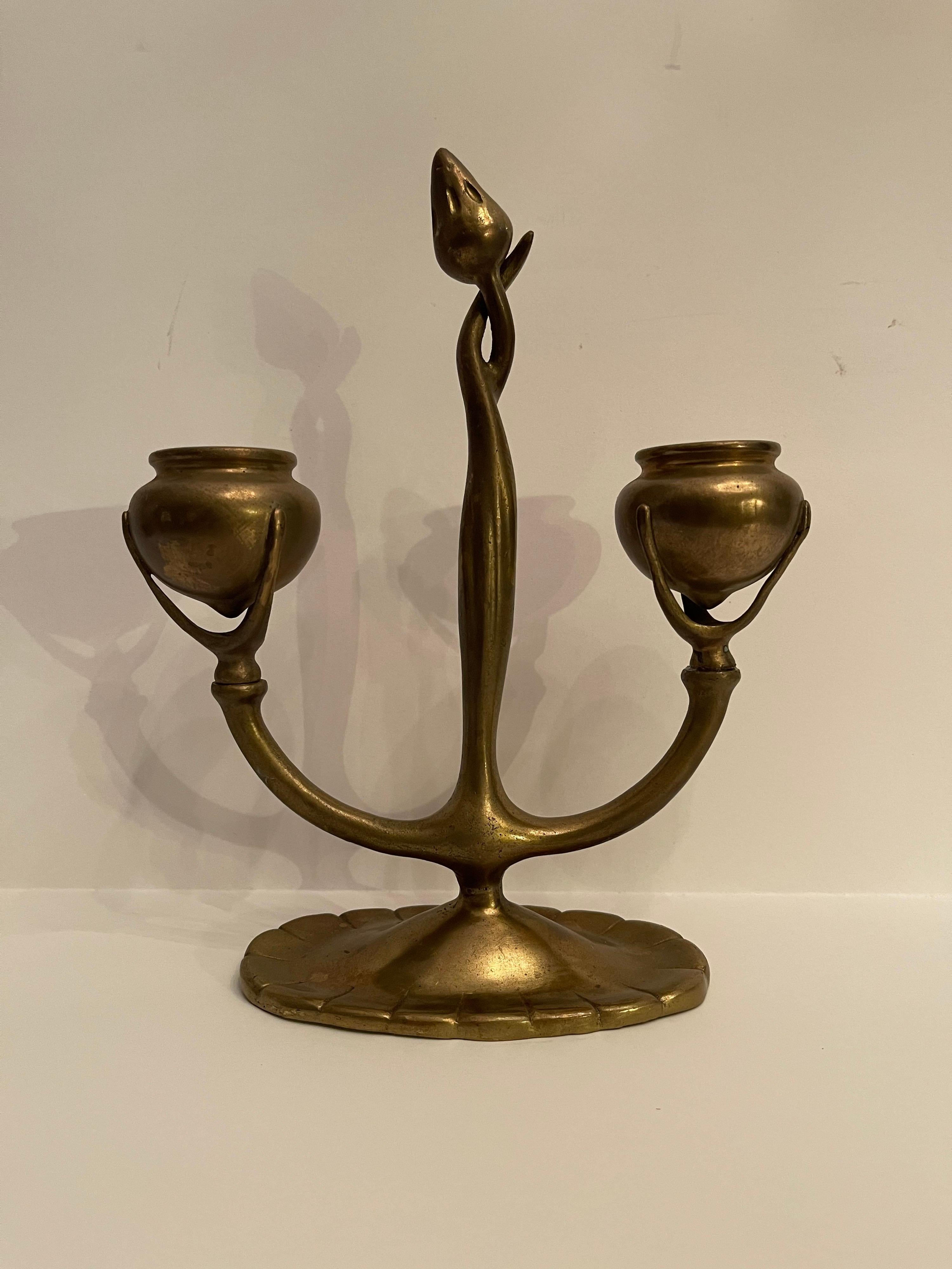 A wonderful pair of Tiffany Studios Poppy flower bud centers candelabrum, 
in the Art Nouveau Design finished in doré bronze gold finish
Stamped: Tiffany Studios/NEW YORK 1230 With Tiffany Studios S In Oval 

Measures: 
Height 9 inches
Width 7