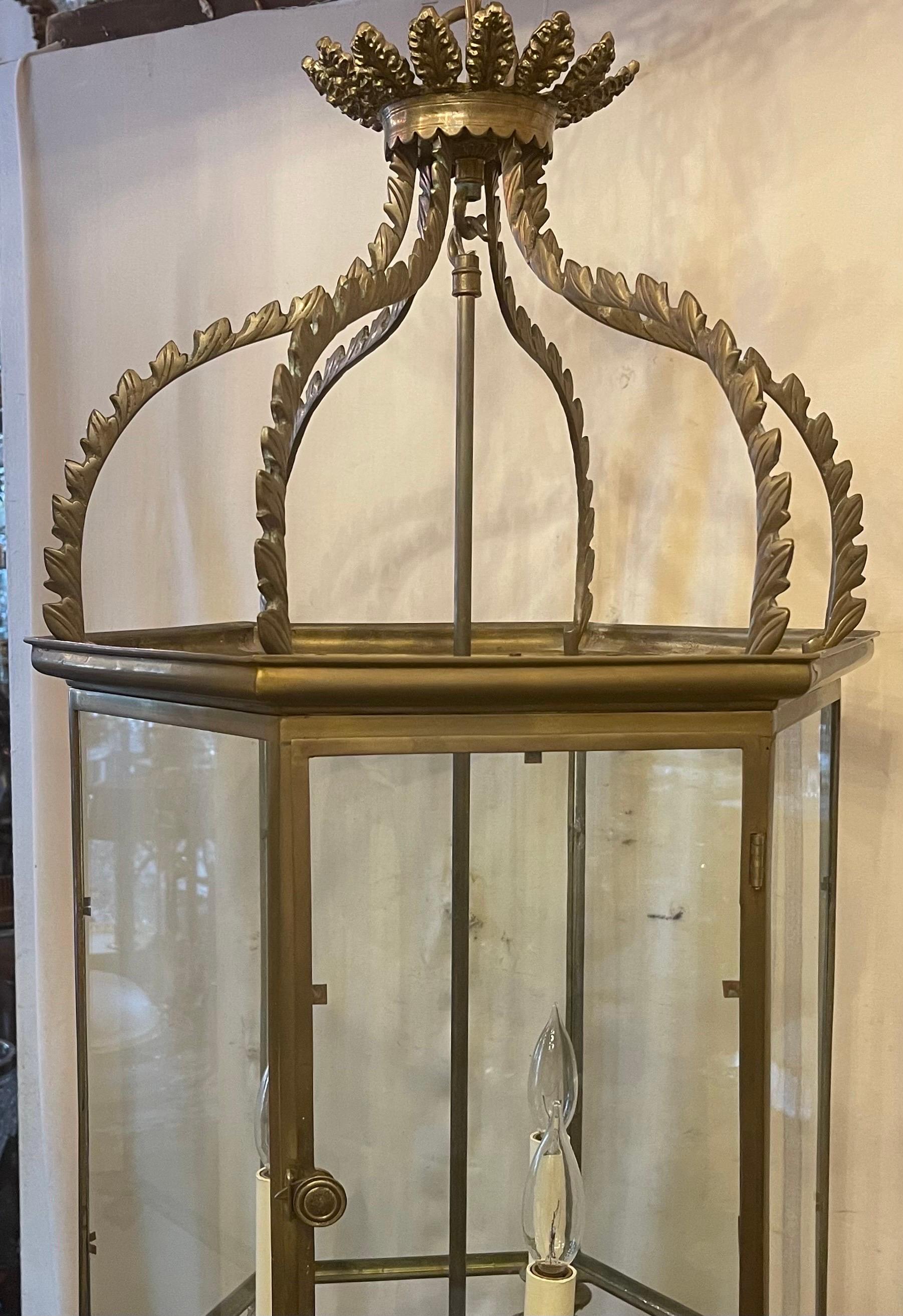 A Wonderful Vaughan lighting bronze / brass regency hall lantern, This Classic Lantern is Based On A 19th Century Six-Sided Fixture That Is Finished With Feathered Detailing And A Leaf-Like Top Coronet, With A 3 Light Cluster Inside, Accompanied By