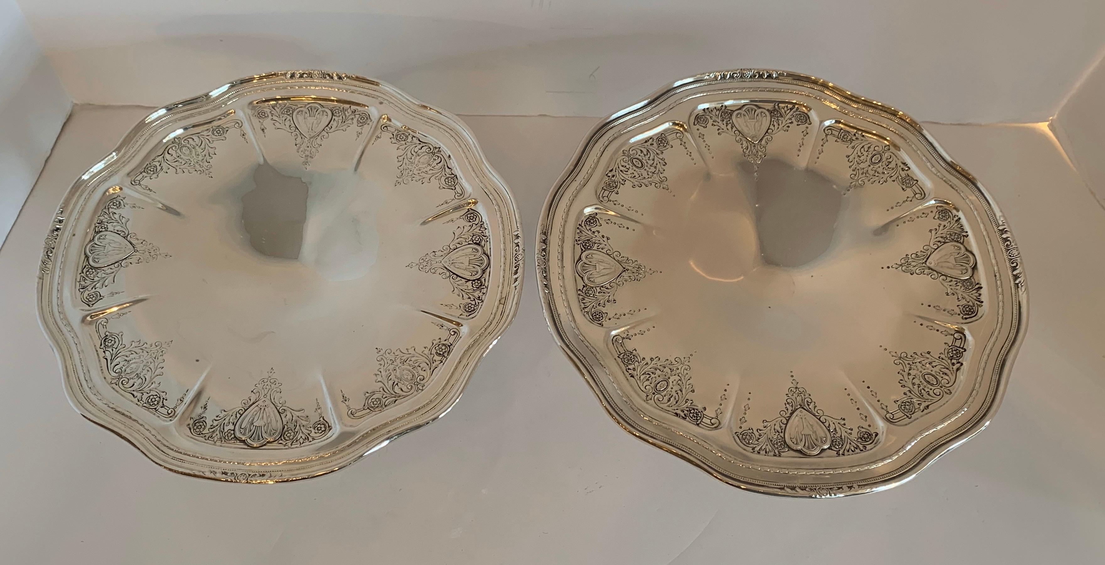 A wonderful pair of whiting Sheraton sterling silver hand chased centerpiece compotes.
,  