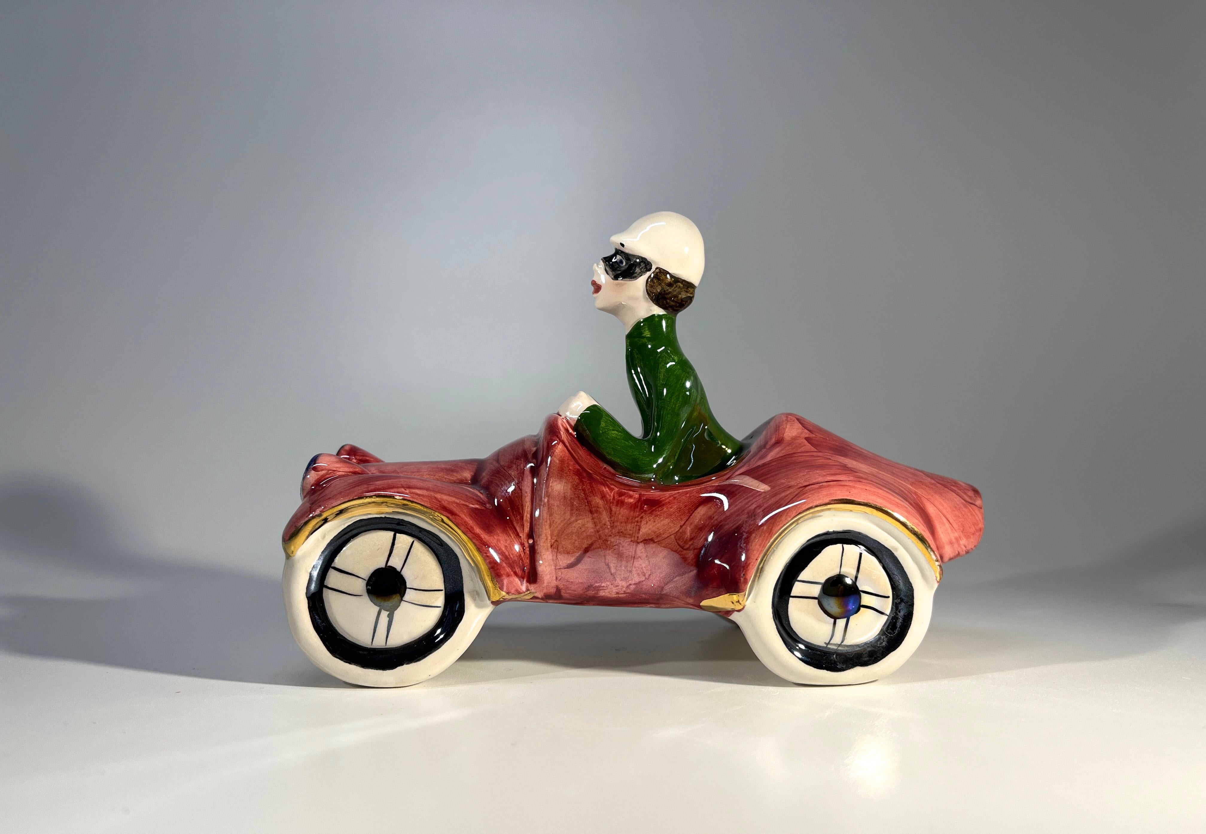 Italian ceramic car and driver from the 1960's, a fun piece of Italian kitsch
Rossa pink lustre glaze - beautifully respected
Circa 1960's
Signed Italy
Height 4 inch, Width 6 inch, Depth 2.75 inch
In excellent condition
Wear consistent with age and