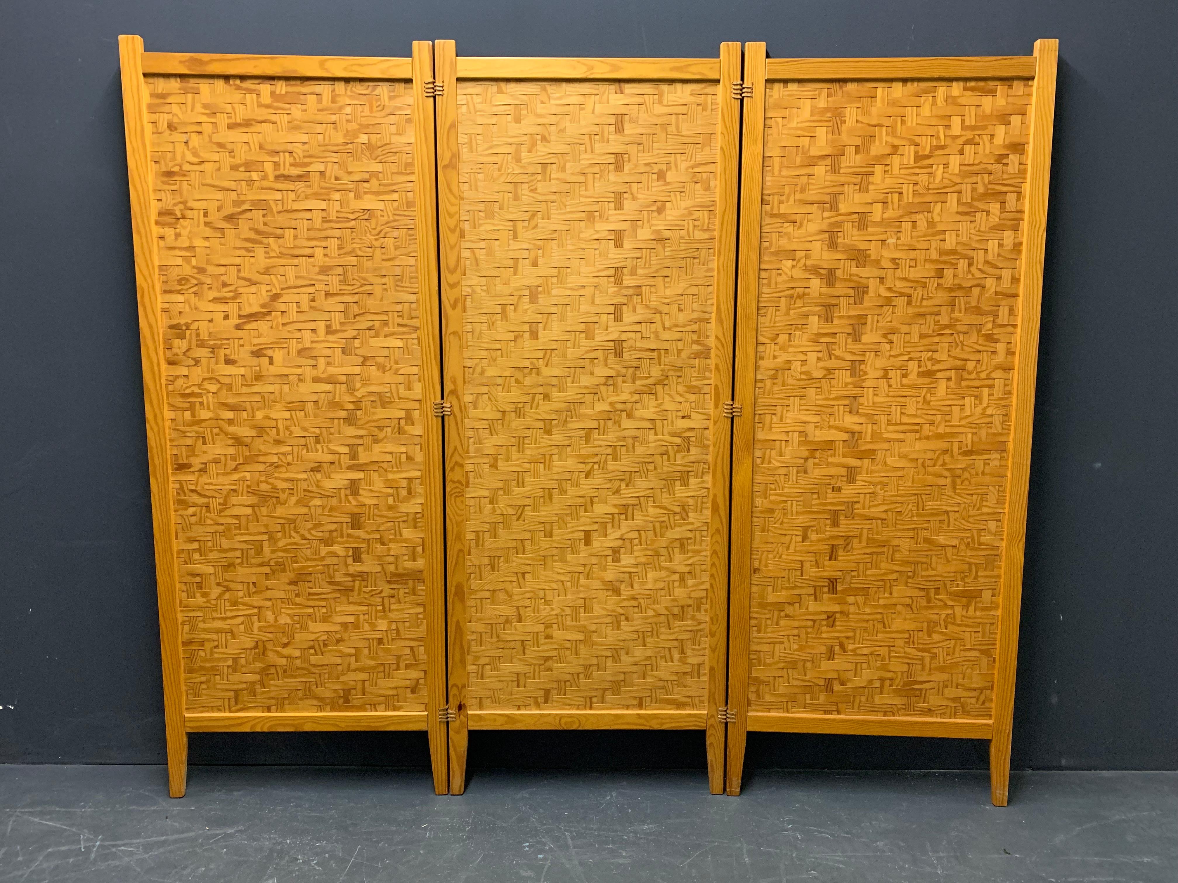 Made from woven pine stripes in massive wooden frames connected with leather.

 