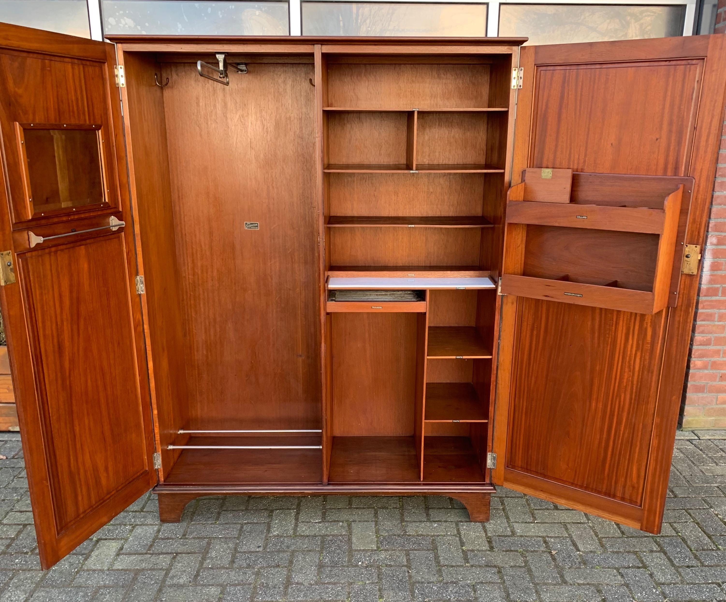 Superb condition and very stylish, antique English clothes cabinet.

This stunning wardrobe is another great example of the quality of English furniture making in the early 1900s. All handcrafted out of solid mahogany this gentleman's cabinet also