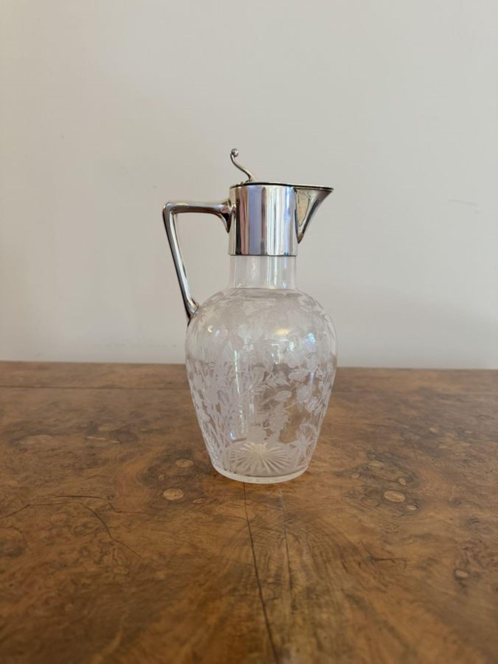 Wonderful quality antique Victorian silver plated claret jug, having a silver plated top and handle with a quality etched glass body detailed with birds, flowers, trees and leaves. 

D. 1880
