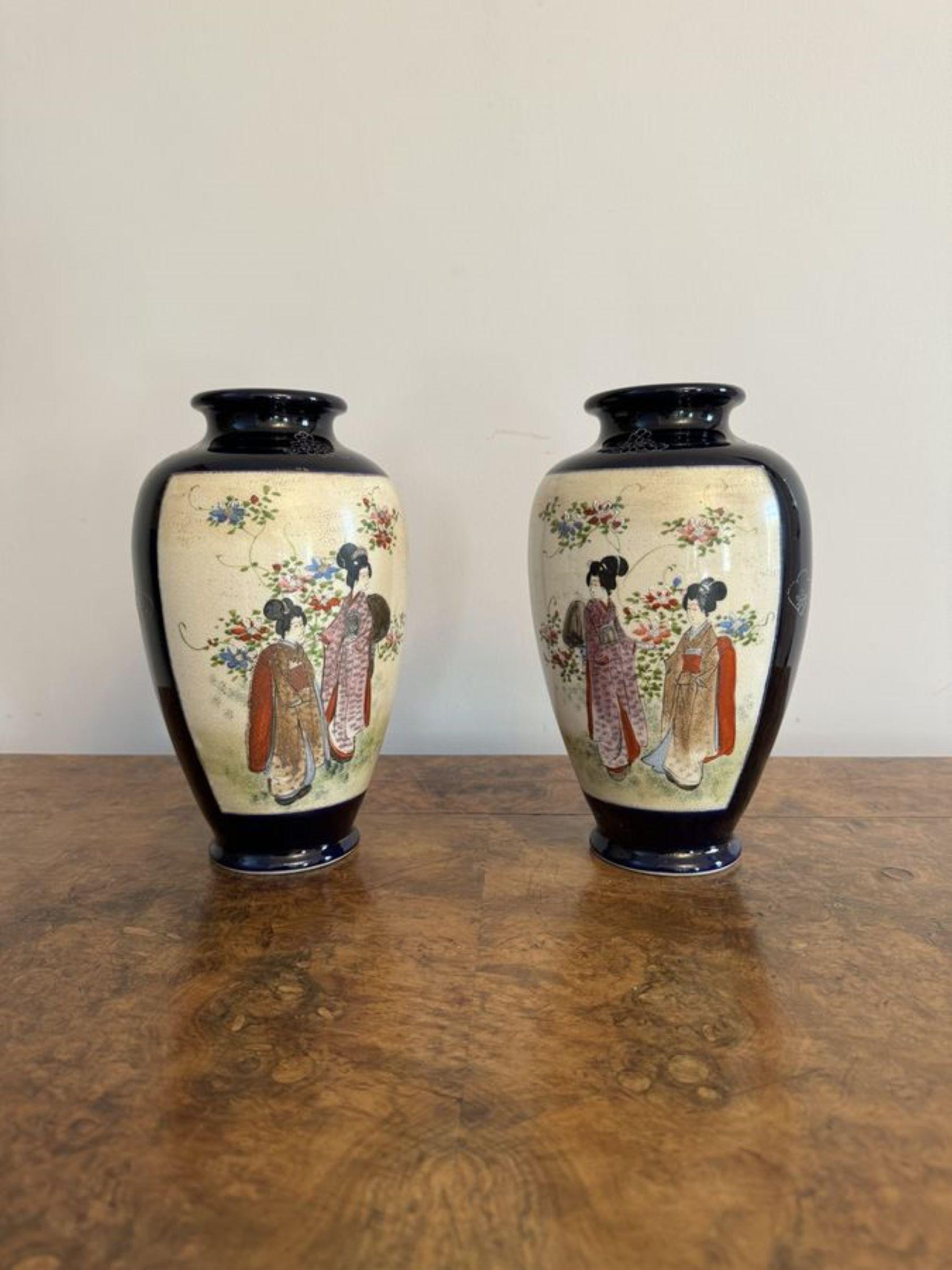Wonderful quality pair of antique Japanese satsuma vases having a quality pair of antique Japanese satsuma vases with wonderful hand painted decoration of figural and landscape scenes in blue, red, orange, green, black and gold colours on a blue and