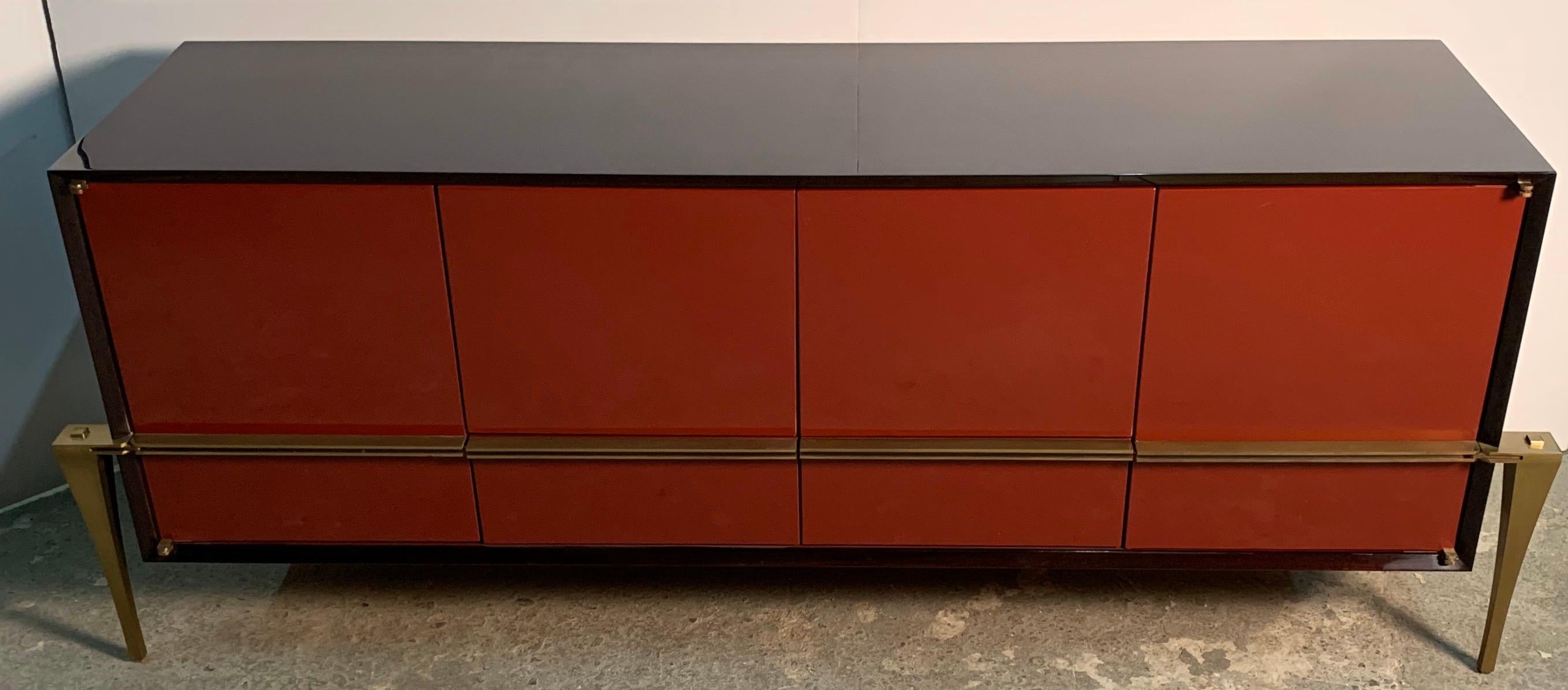 A wonderful red lacquered and Australian walnut with bronze legs and Handel's credenza cabinet by The World Famous Lorin Marsh Showroom
Titled 