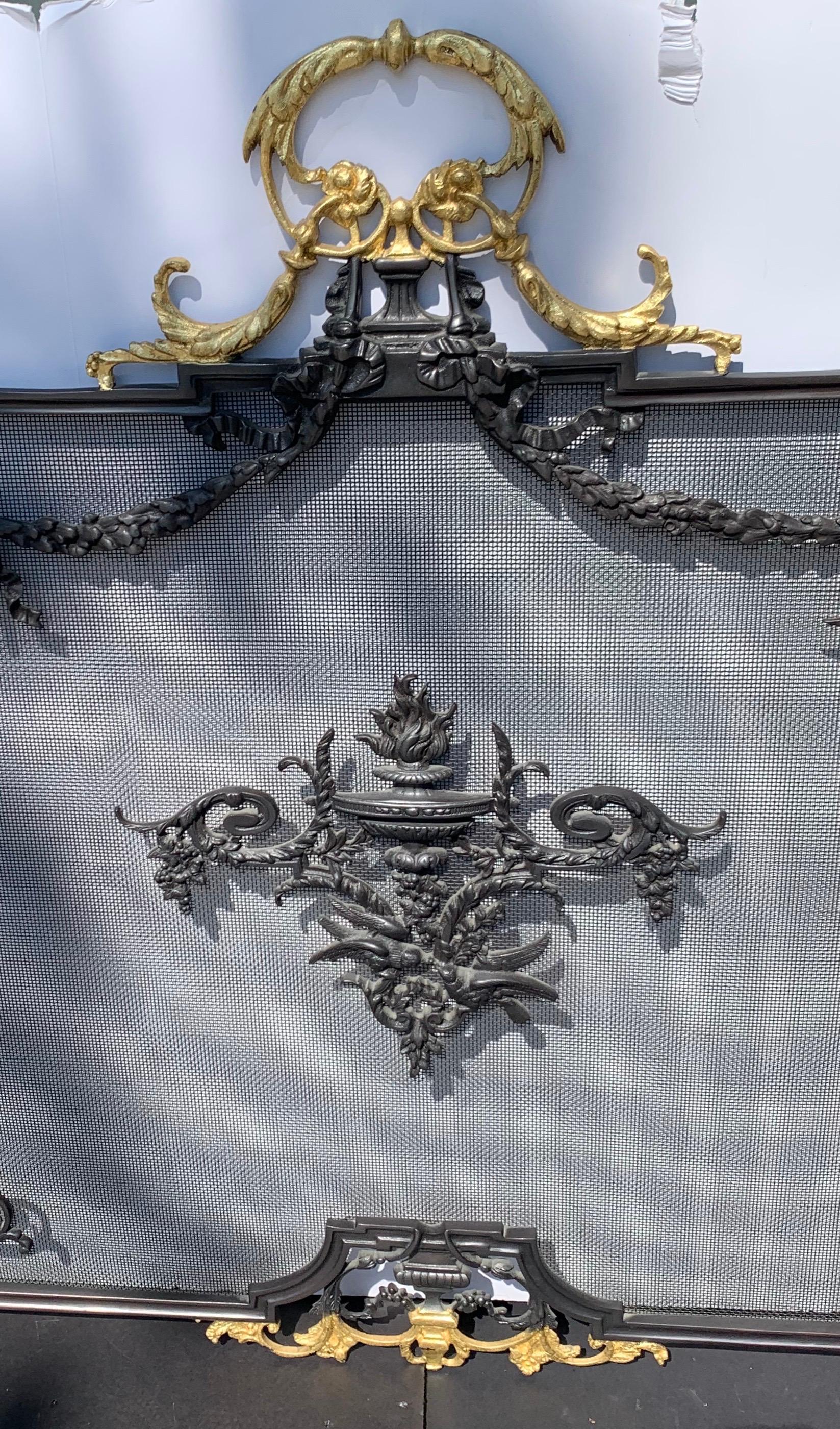 A wonderful Regency / neoclassical French gilt and patinated two toned bronze Empire fireplace screen.