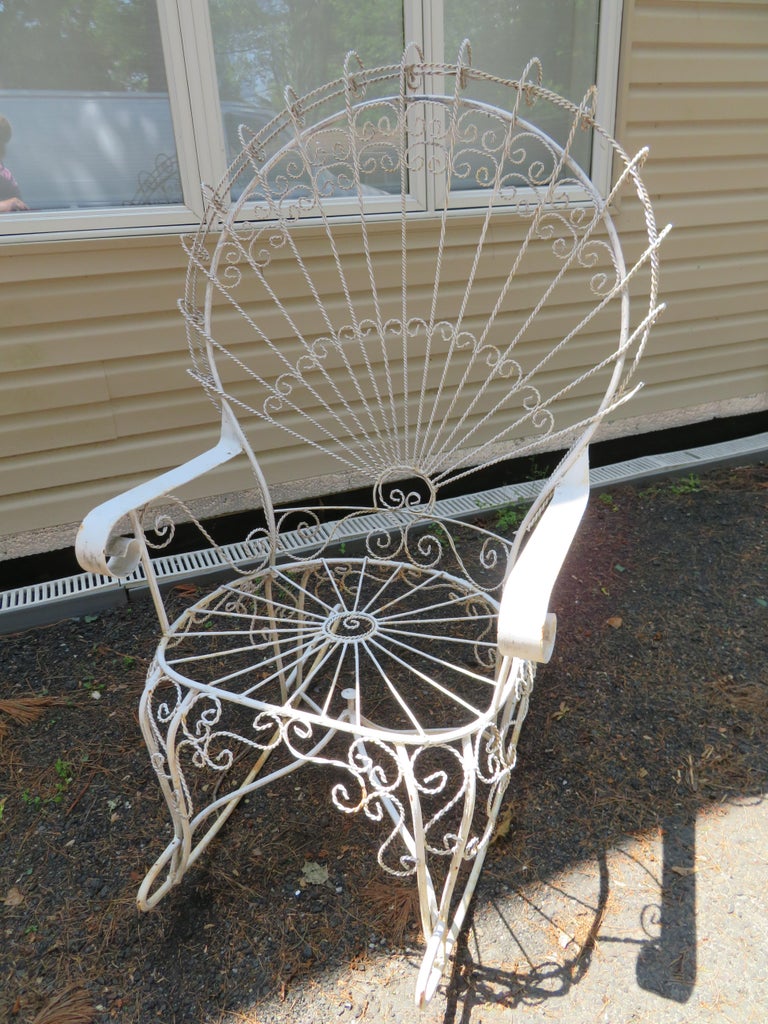 Wonderful 1960s John Salterini vintage midcentury wrought iron wire peacock rocking chair. Please see our huge selection of other pieces from this collection-chairs, tables, and benches.
