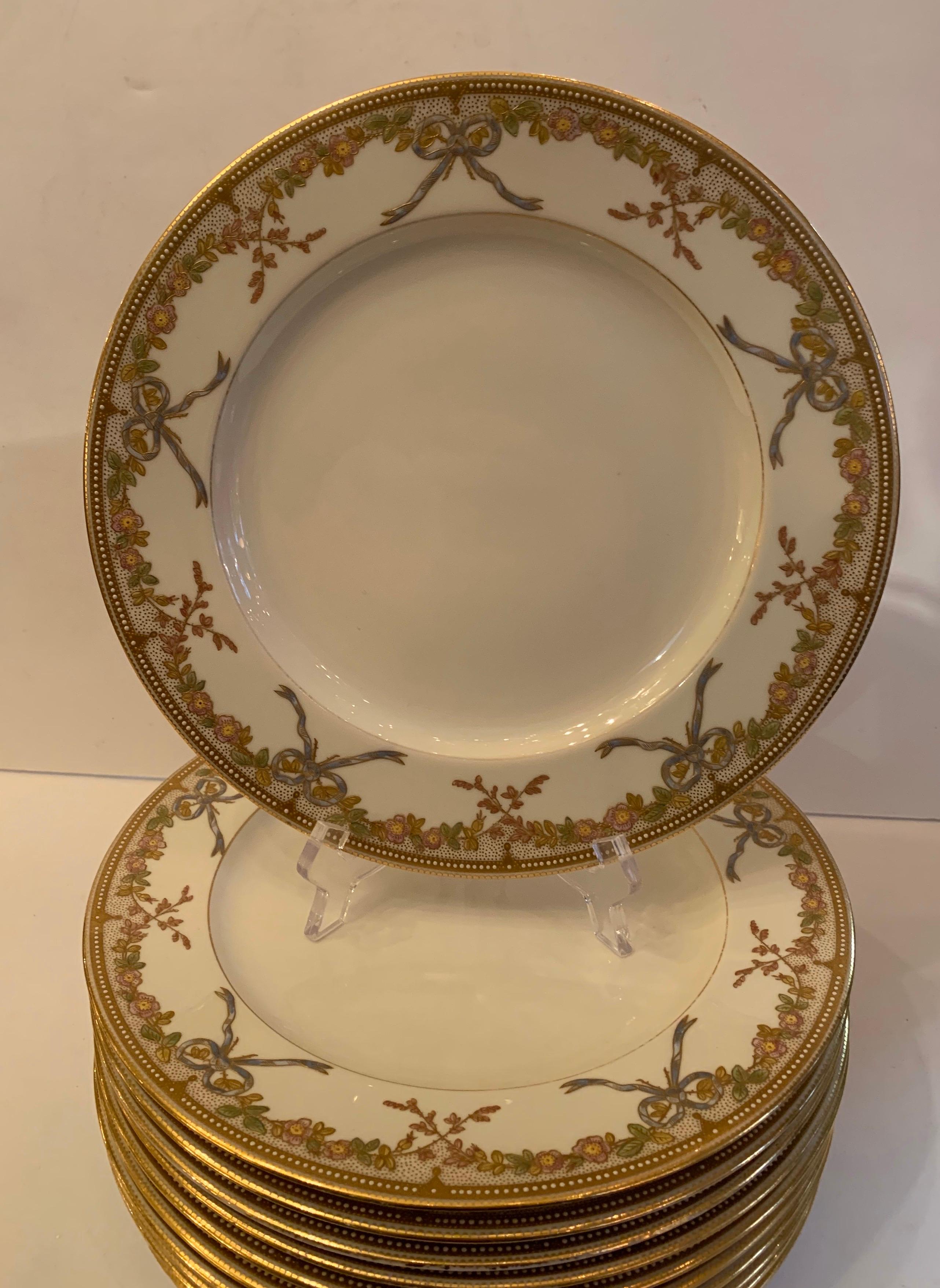 A wonderful service for 11 hand painted porcelain Copeland raised bows and flowers dinner plates
On the back:
A. B. Daniels & Son
46 Wigmore St.
London W
Copeland China.