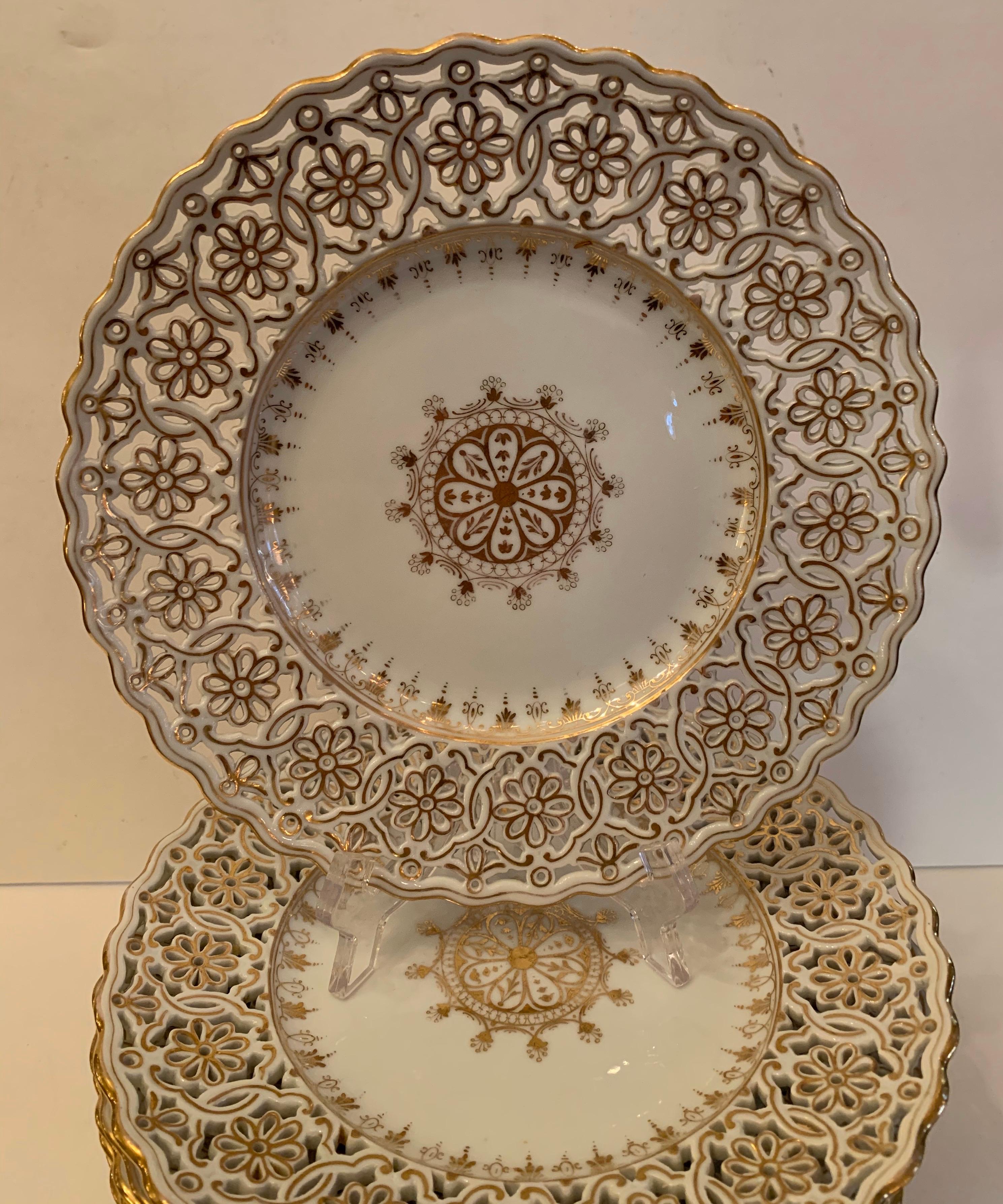 A wonderful service for 12 pierced hand painted porcelain Dresden dessert plates.