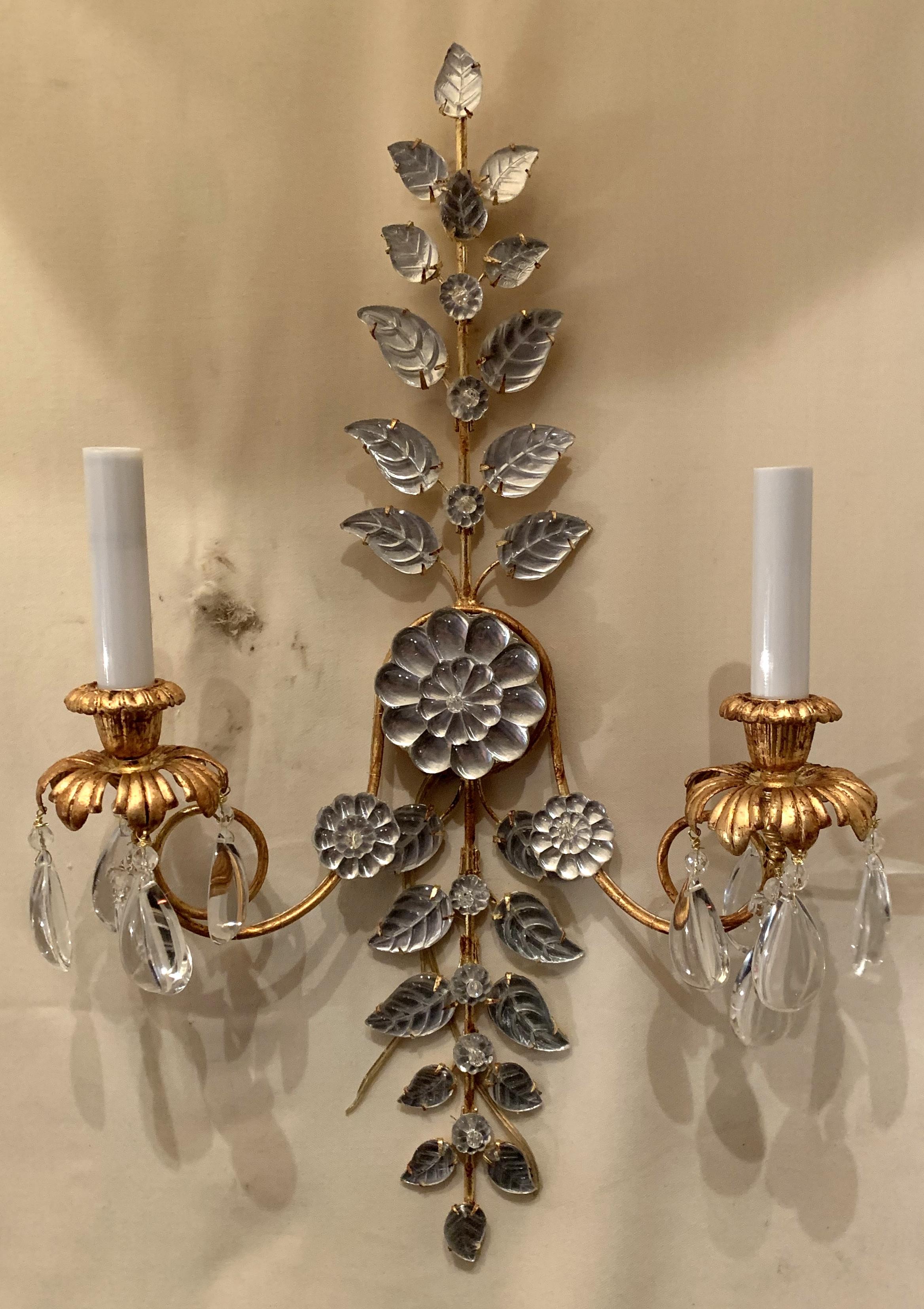 A fabulous set of 4 or 2 pairs of French leaf and flower medallion beaded crystal and gold gilt two-arm sconces in the Mid-Century Modern manner of Baguès, rewired with new socket.
Sold per pair.
Measures: 22
