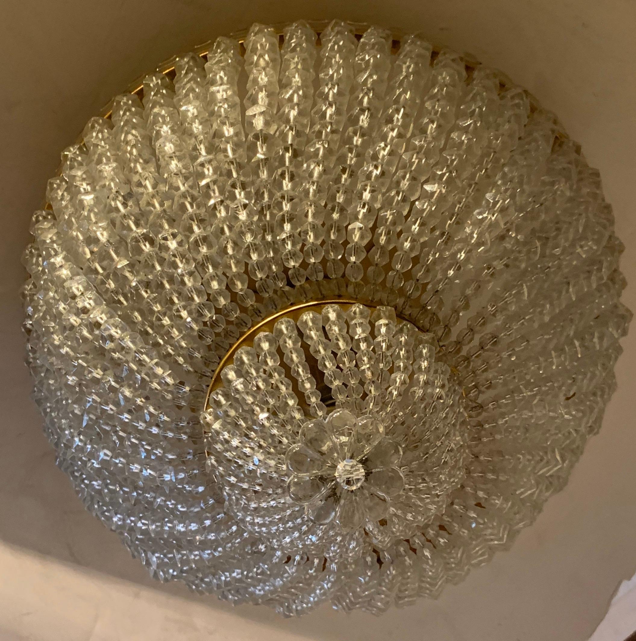 A wonderful set of 4 beaded crystal basket form flush mount brass ceiling light fixtures with a candelabra socket in each, rewired with new sockets and ready to install. 

Each sold separately.
