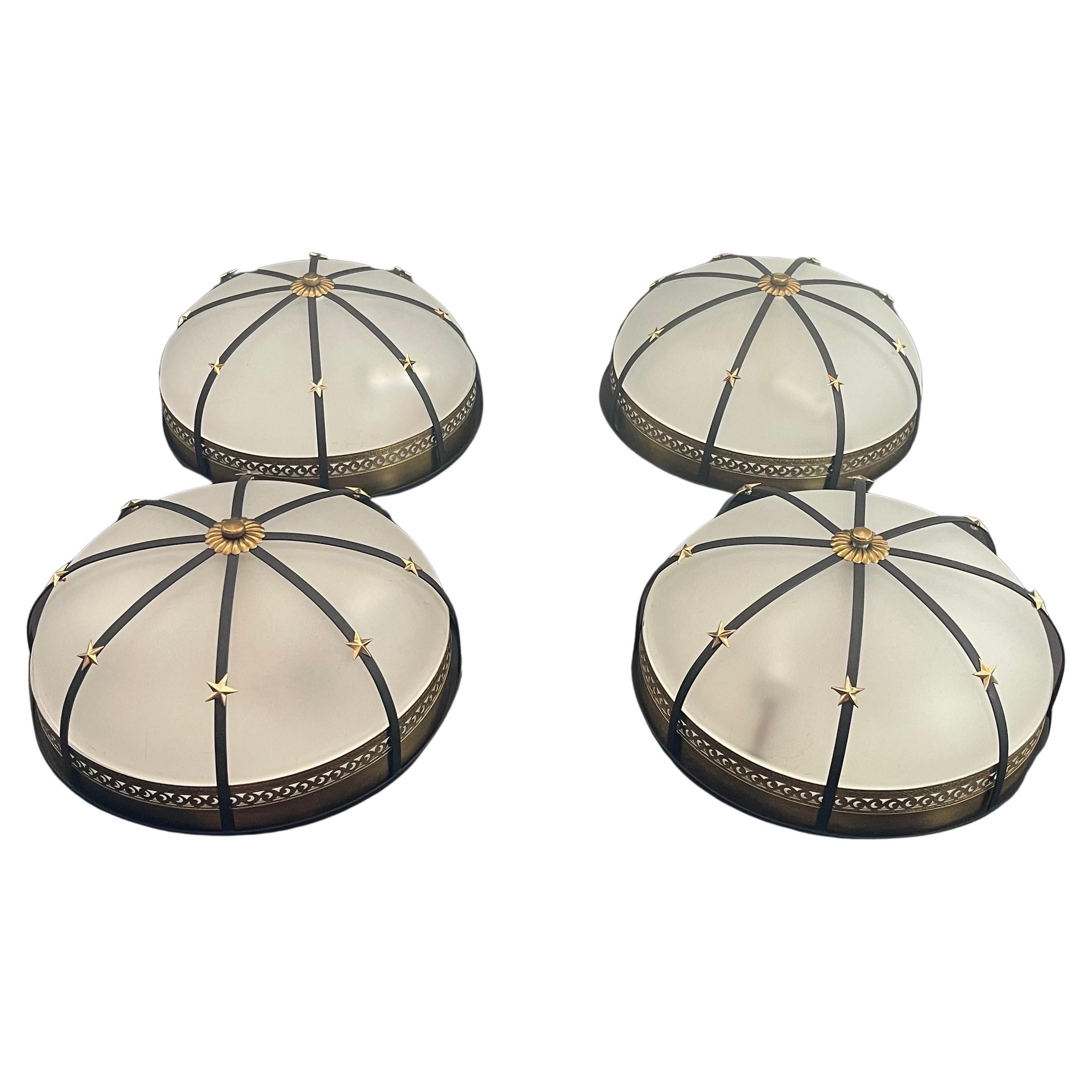 A Wonderful Set Of 4 Vintage Regency, Empire, Bronze Star Ormolu Rim Over A Frosted Glass Dome Flush Mount Fixtures Each With 2 candelabra lights Inside.

Each Fixture Sold Individually $1,450.00.