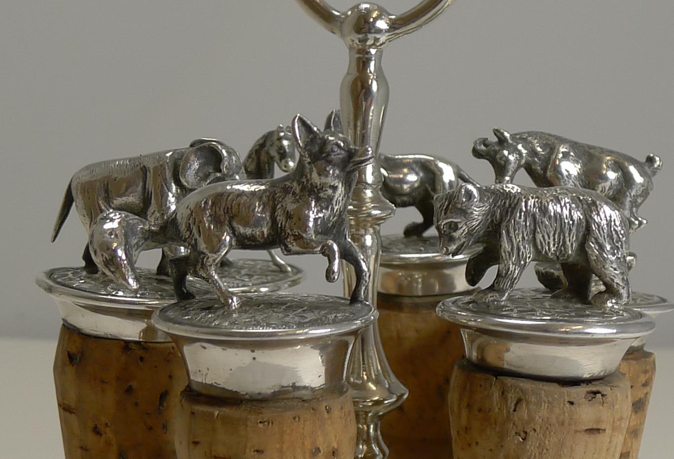 A magnificent and fun set of wine/bottle corks, a wonderful addition to any bar. The complete set consists of six corks all topped with a different animal modeled in silver plate. Many are struck withe standing profile bear and B MF AS. Present on