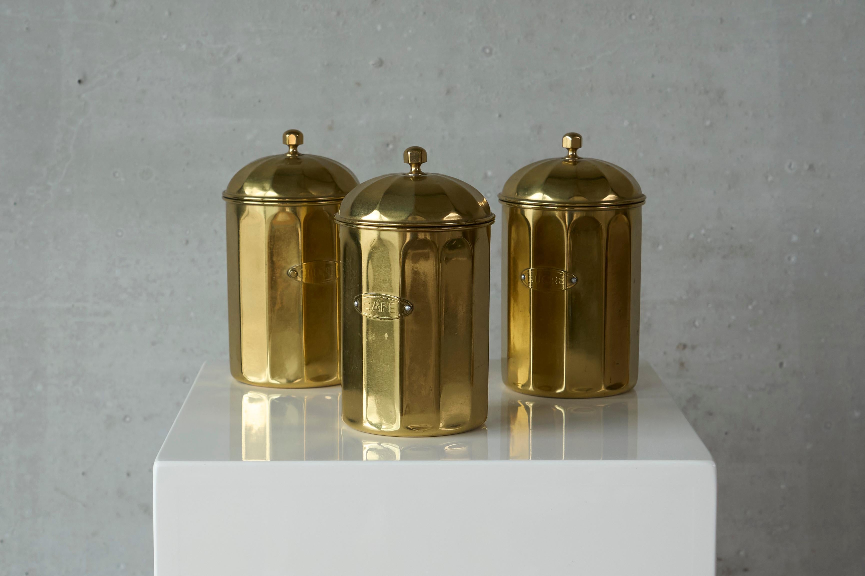 Vintage Set of Brass Kitchen Canisters Coffee Sugar and Hickory, Europe, Early to Mid 20th Century.

This is a beautiful classical set of 3 brass kitchen canisters. Great design with some nice details, like the domed lids, the top knobs and the name