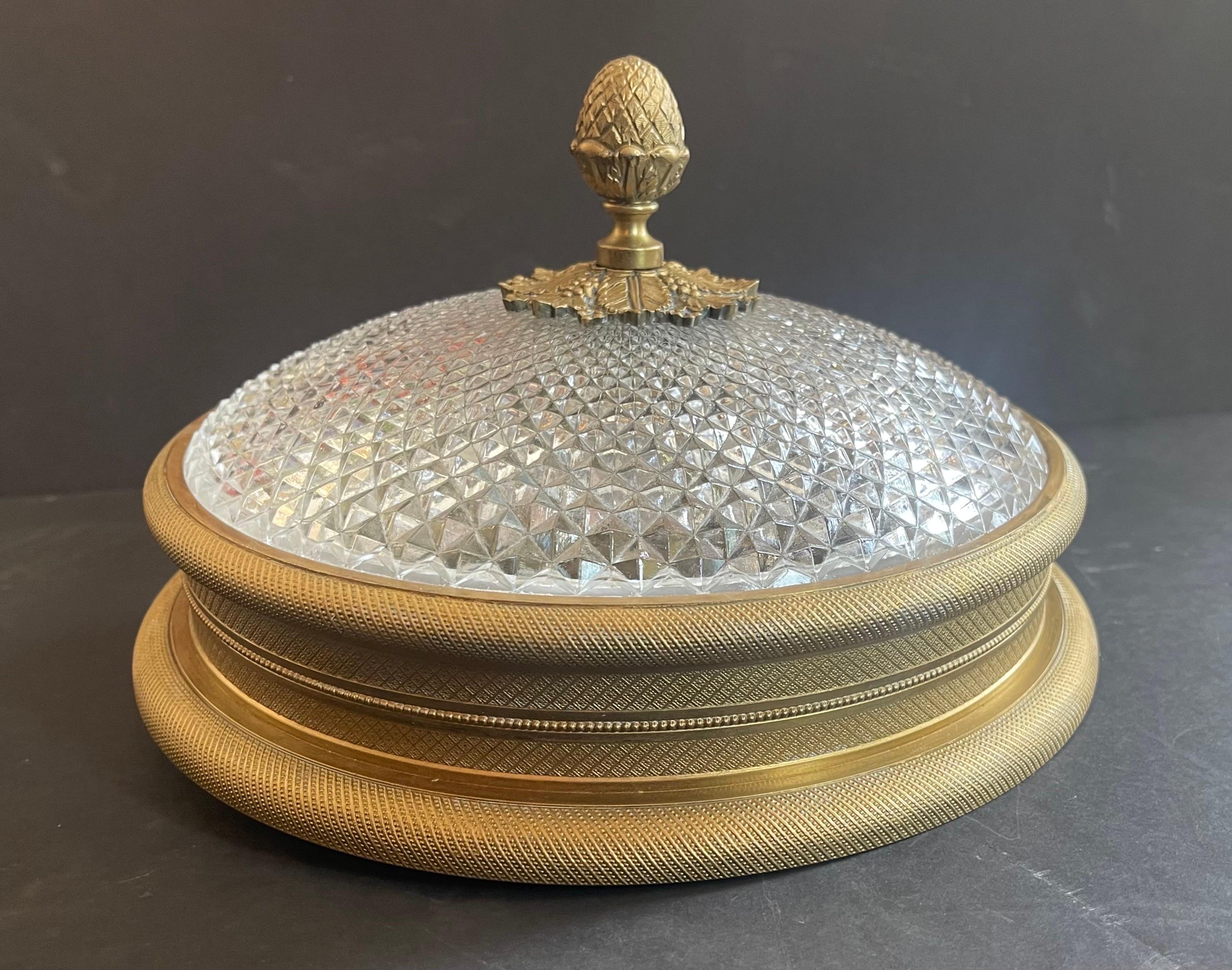 A wonderful neoclassical Sherle Wagner vintage knurled ceiling light in doré bronze gold patina. This low profile two candelabra light fixture (max 60watts per socket) is perfect for lower ceiling applications. This beautiful flush mount is finish
