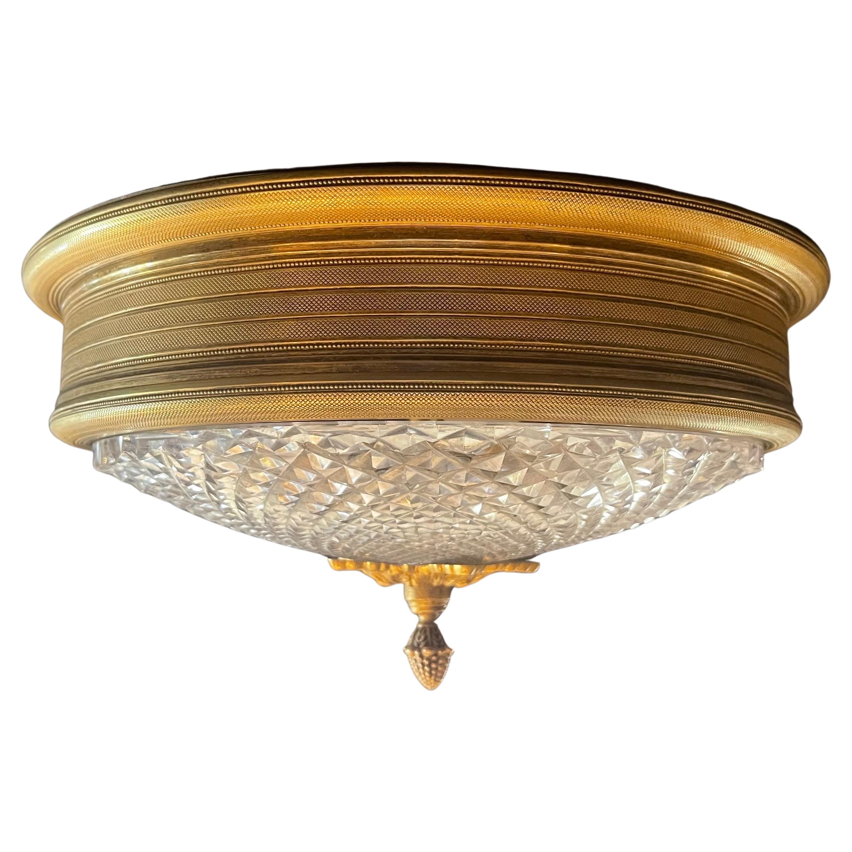 A wonderful sherle wagner knurled doré gilt bronze / faceted cut crystal / glass Fflush mount 3 candelabra light fixture.
