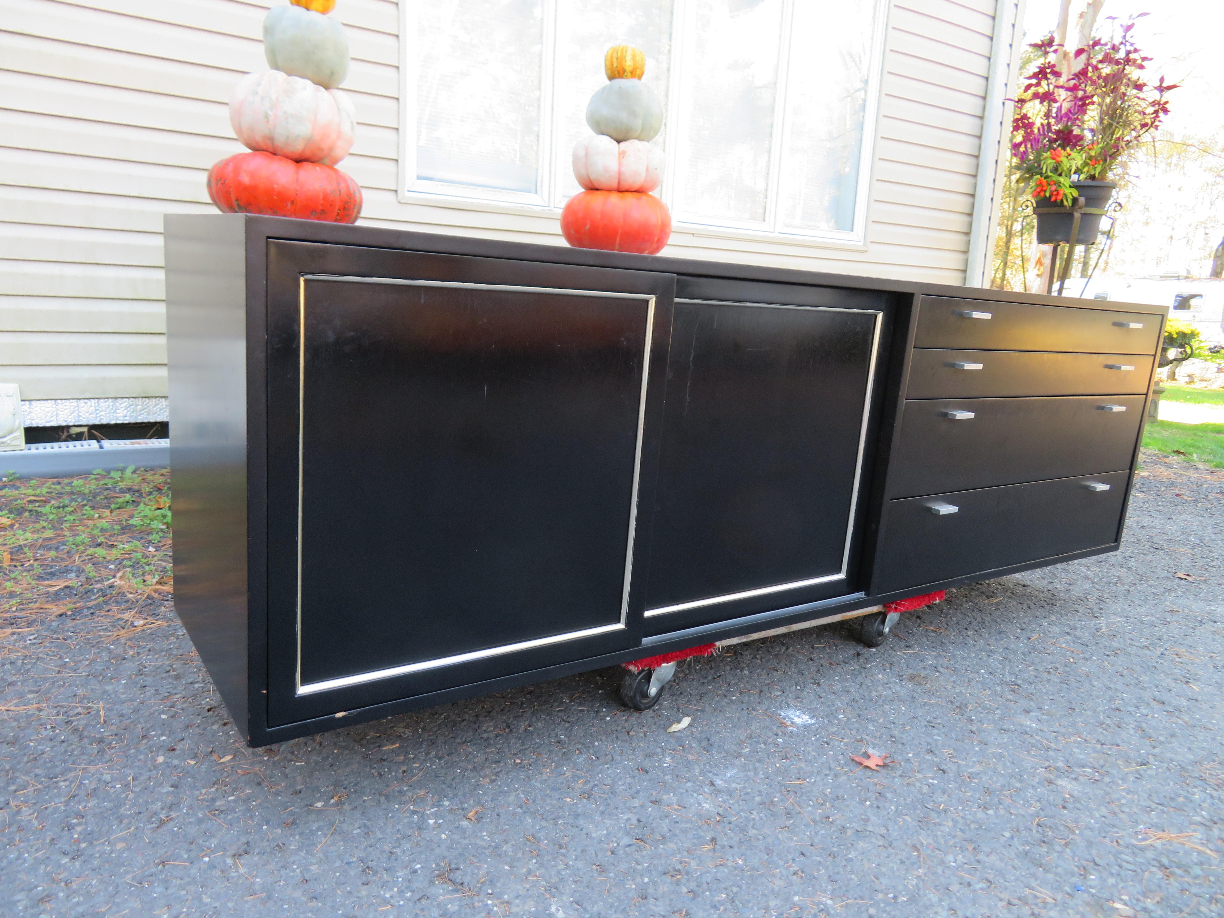 Wall-mounted credenza by Harvey Probber, American, 1950s. “Harvey Probber” label inside the top drawer on right side. This piece measures 22.5