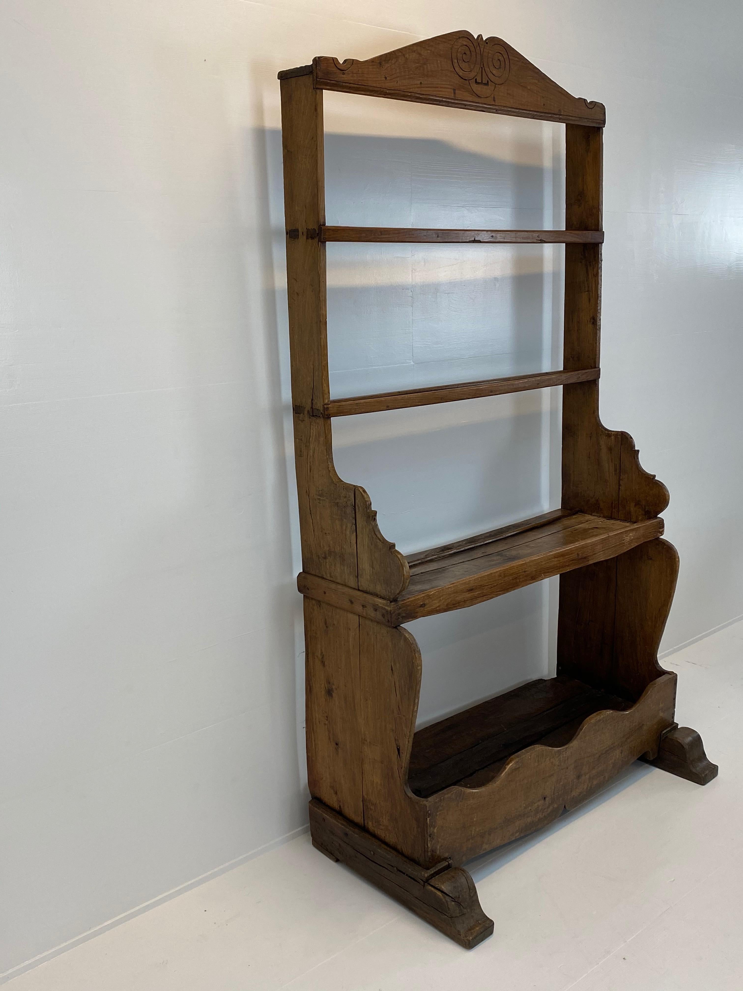 Spanish cupboard with open plate rack and open bottom shelving,
lovely carved silhouette with some very simple rustic decorations,
great old and correct patina of the Chestnut,
great piece to show your porcelain or other collections,
looks great