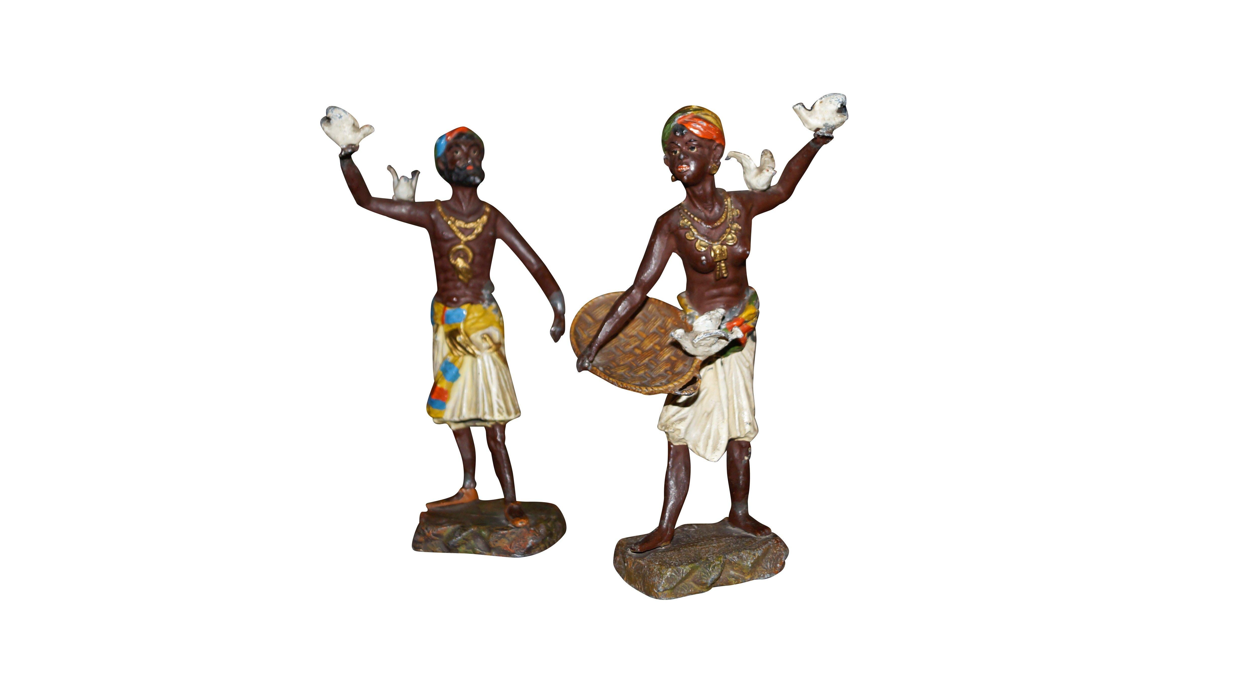 Beautifully designed, colored and gorgeous Moors Statuettes designed.
Very detailed, made from resin.
They represent the statue of a fighter and a woman with a basket, with 5 birds.
An atmospheric and colourful addition to your interior.