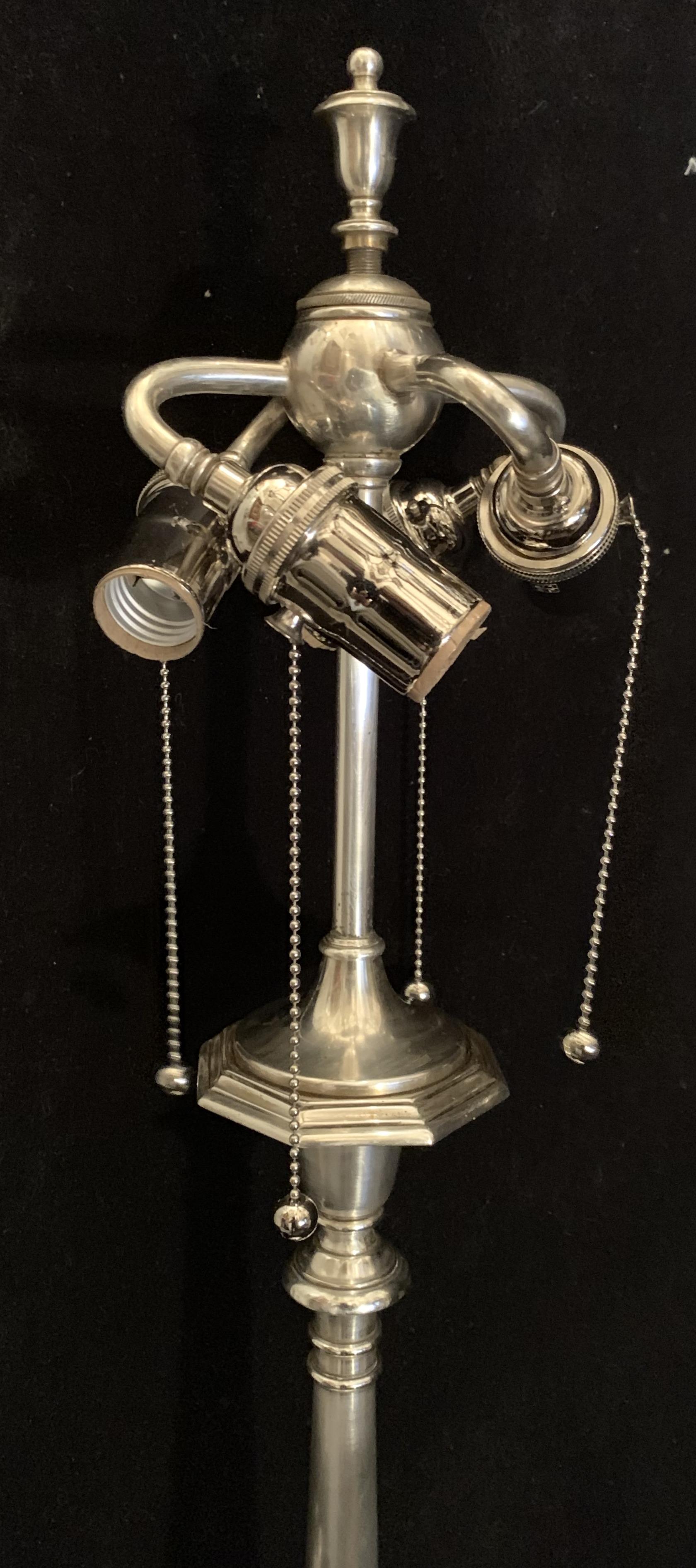 A Wonderful Stamped By The New York Maker: Sterling Bronze Co. Silver / Nickel Plated Over Bronze Table / Desk Lamp With Original Gilded Finish And 4 Edison Pull Chain Socket Cluster.
In The Manner Of E.F. Caldwell
This Lamp Has Been Completely