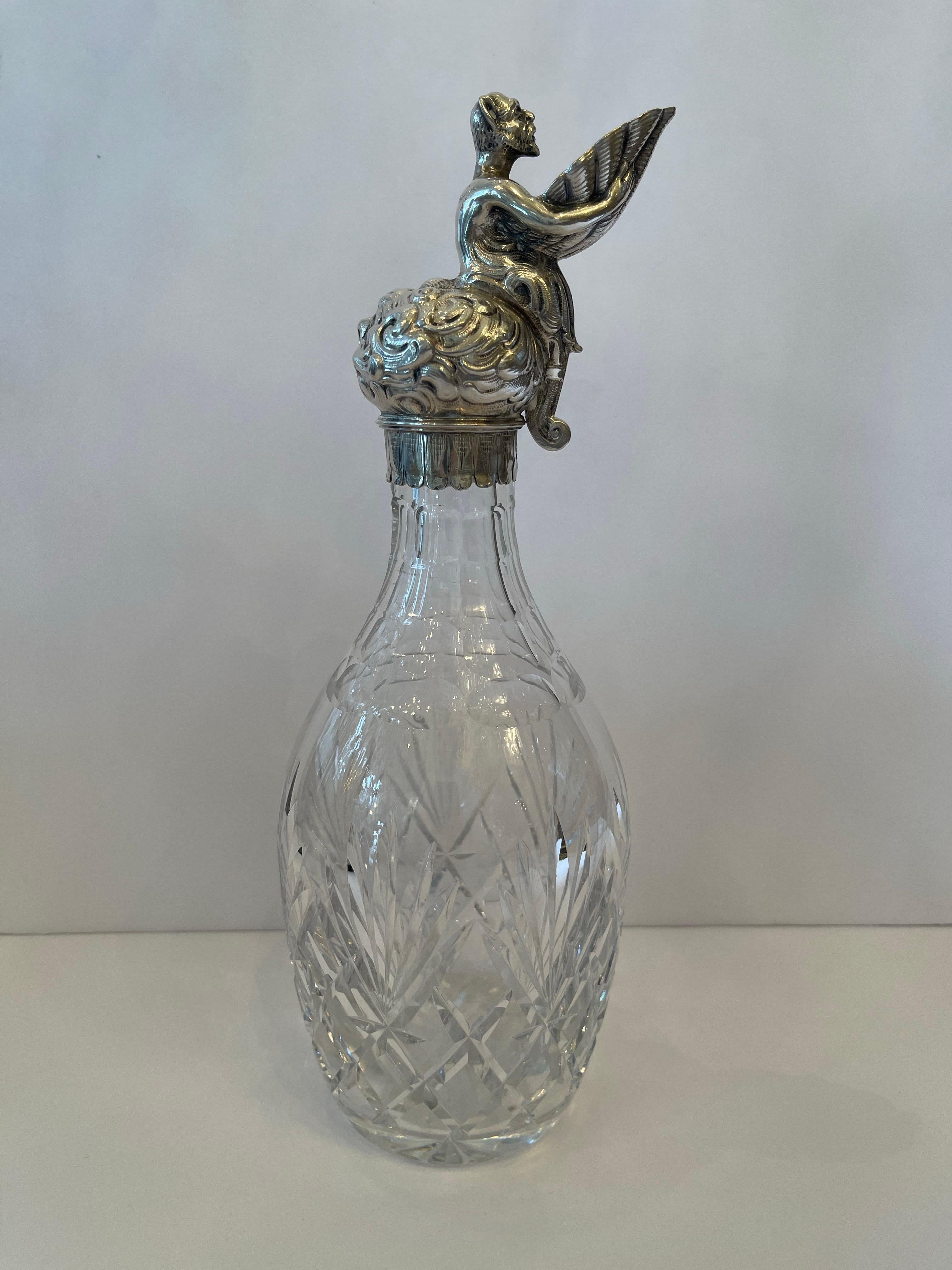 A Wonderful Sterling Silver Ewer With Figure Holding Shell Spout Over A Beautiful Cut Crystal Decanter 