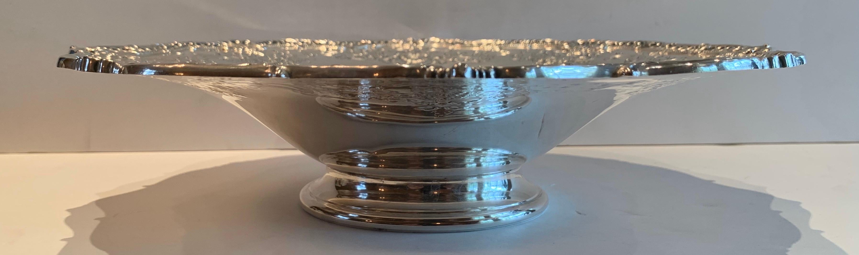 A wonderful sterling silver flower pedestal bowl platter with very fine detail.