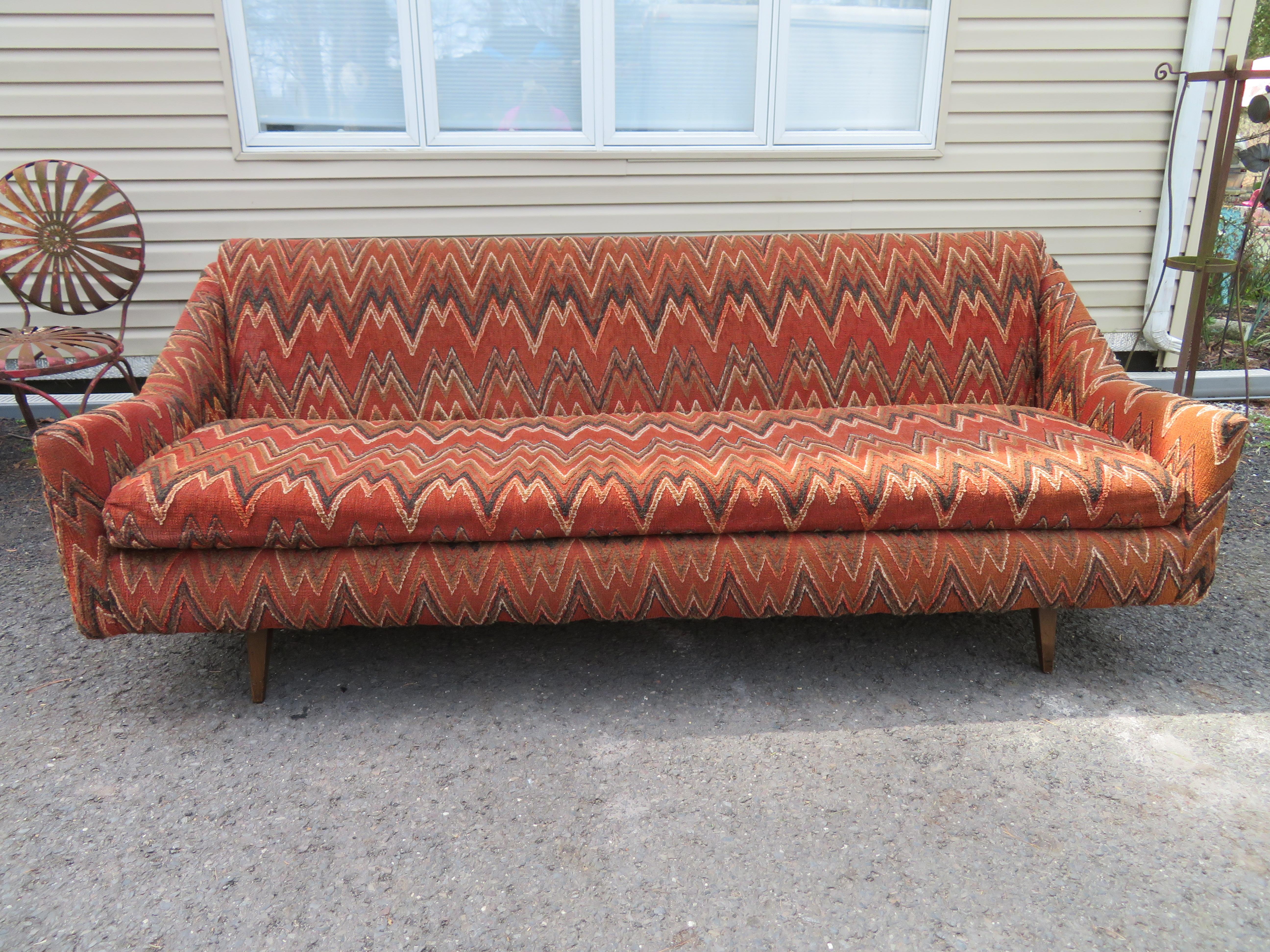 Wonderful Swedish modern Folke Ohlsson Dux style sofa. This sofa retains its original heavy-weight textured zig-zag fabric in presentable condition-cleaning is recommended. The fabric is almost like a tapestry, giving off a super vintage vibe! This