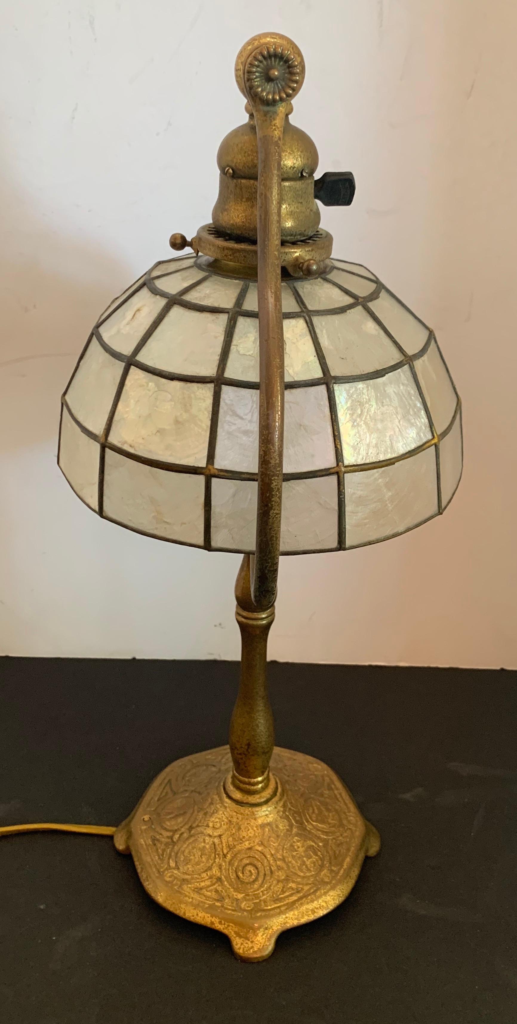 A wonderful Tiffany Studios New York zodiac bronze lamp with capiz shell shade.