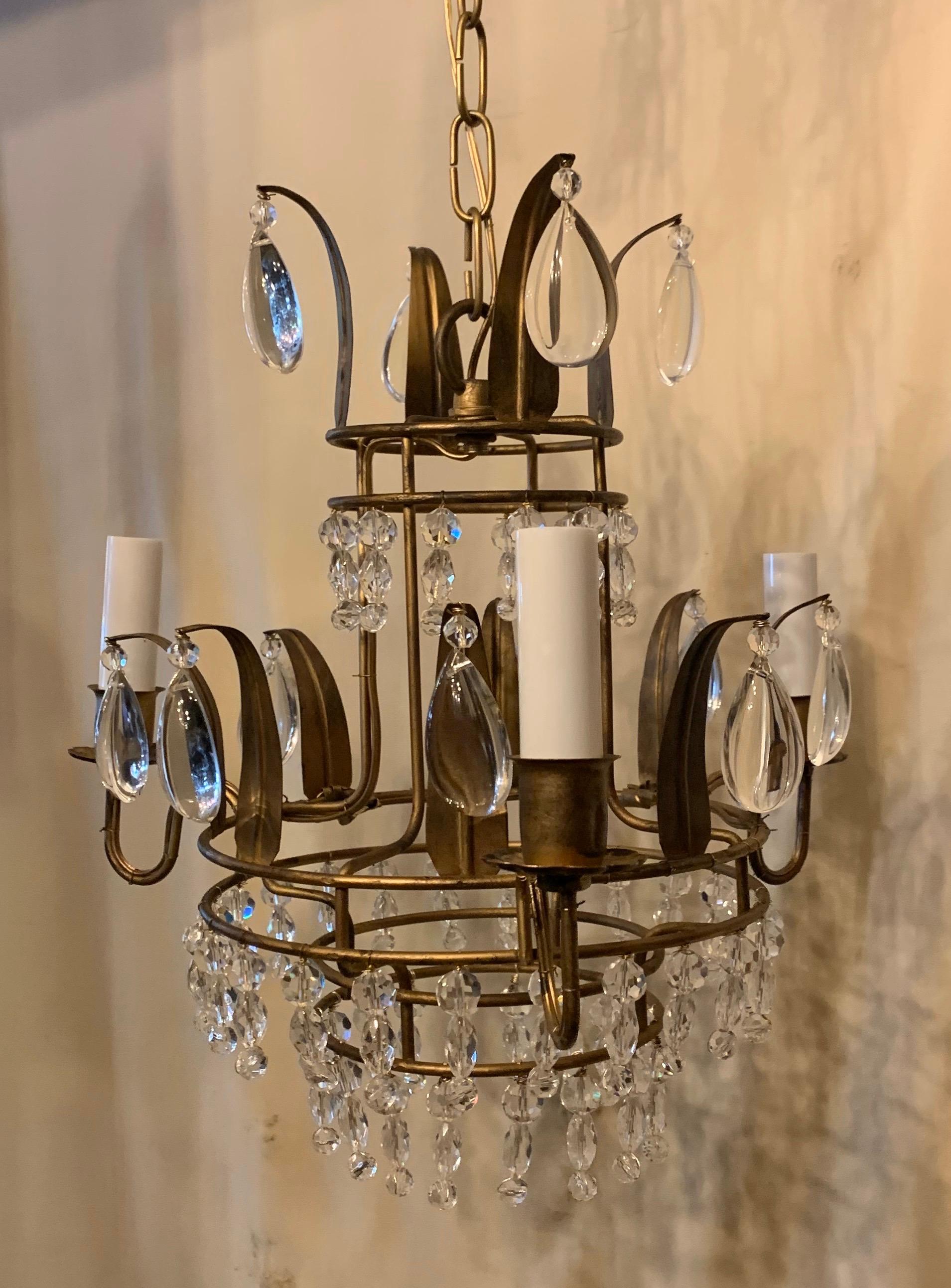 A wonderful gold gilt tole beaded crystal Baguès 3-light petite chandelier light fixture

Completely rewired with new sockets
Comes with chain canopy and mounting hardware.