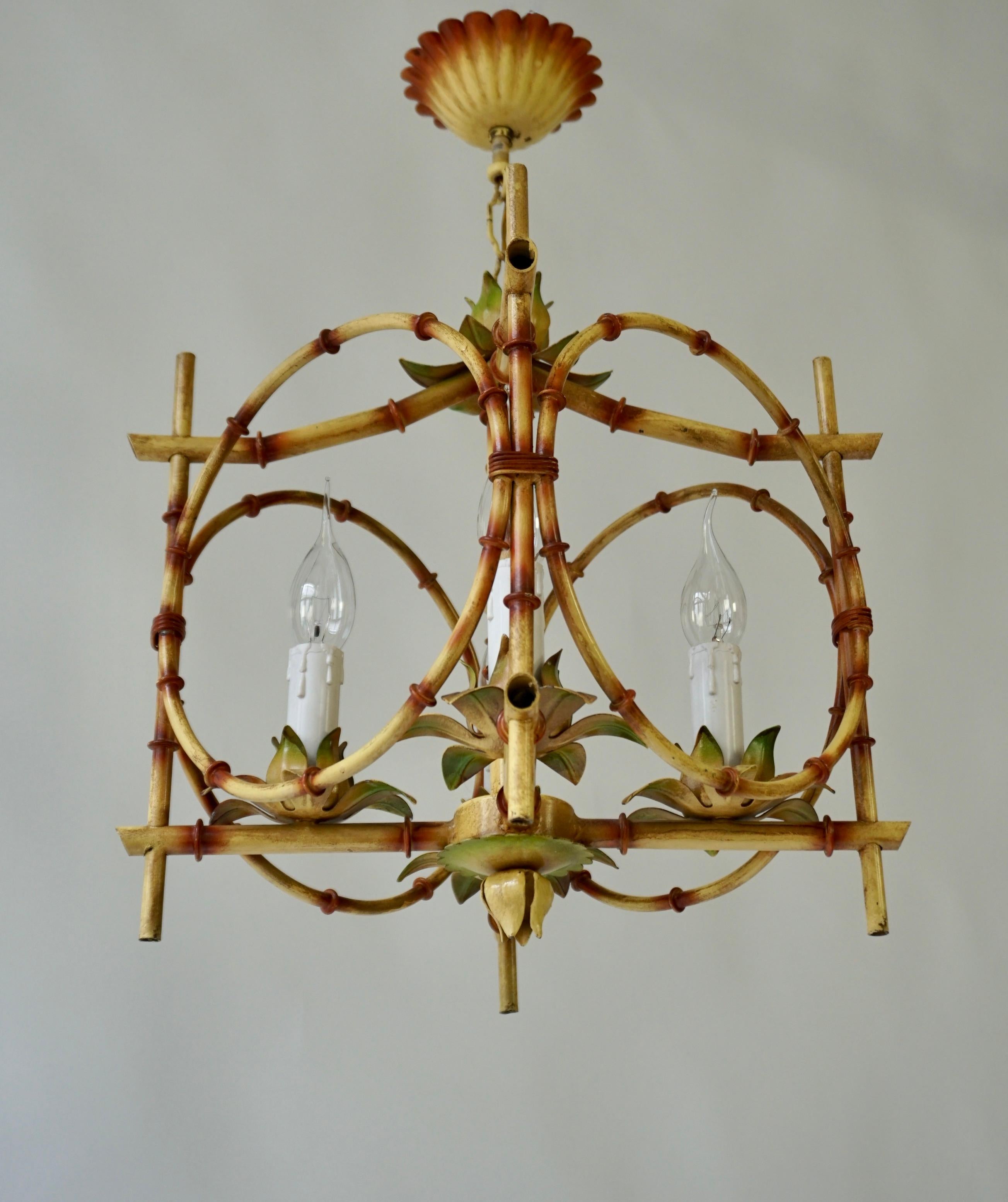 A rare Italian painted faux bamboo pagoda chandelier in the original paint, naturally tinted. The chandelier dates from the 1950s and contains four E14 fittings, both with an original chain and a matching scalloped ceiling rose.

The ceiling light