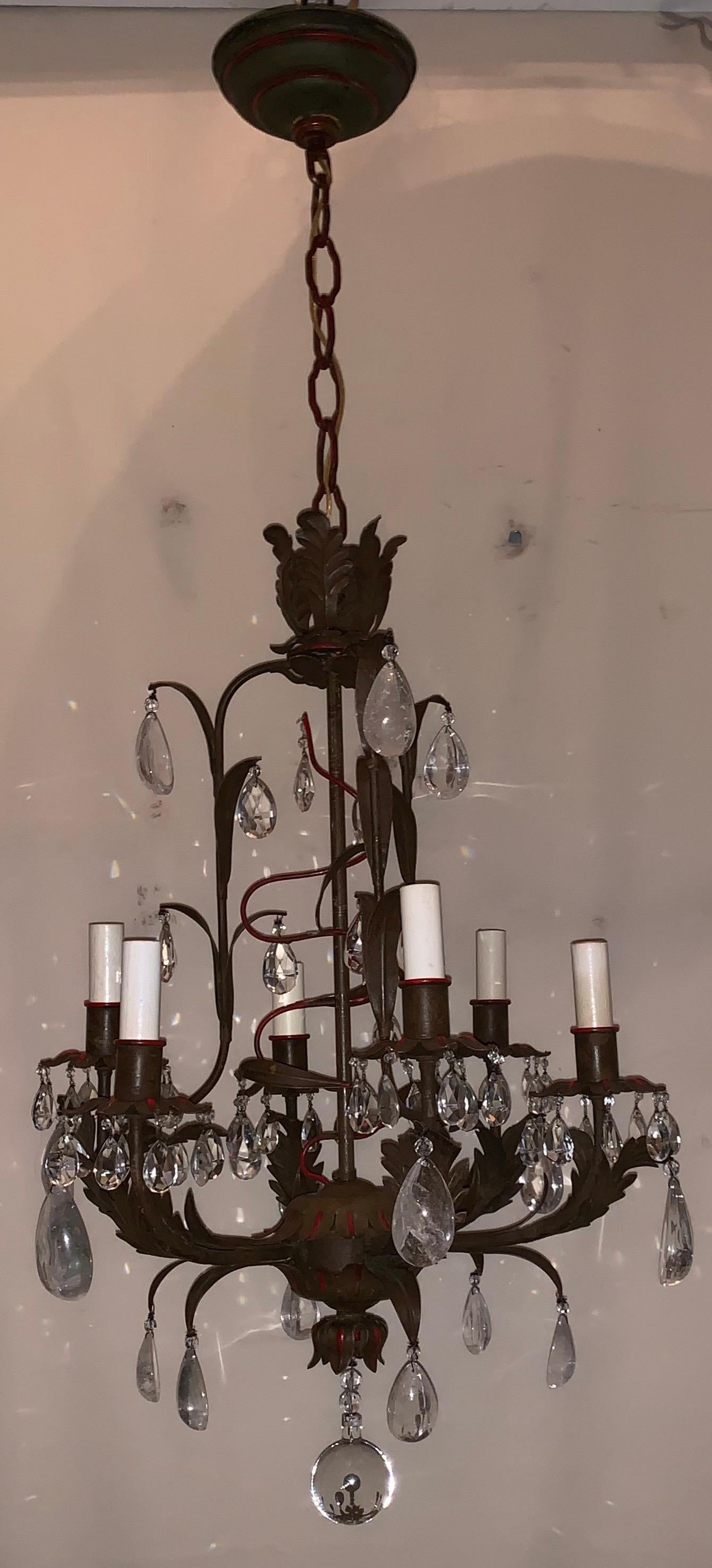 A wonderful tole rock crystal and faceted tear drop crystal Baguès style, red trim 6 candelabra light petite chandelier
Rewired and ready to enjoy.