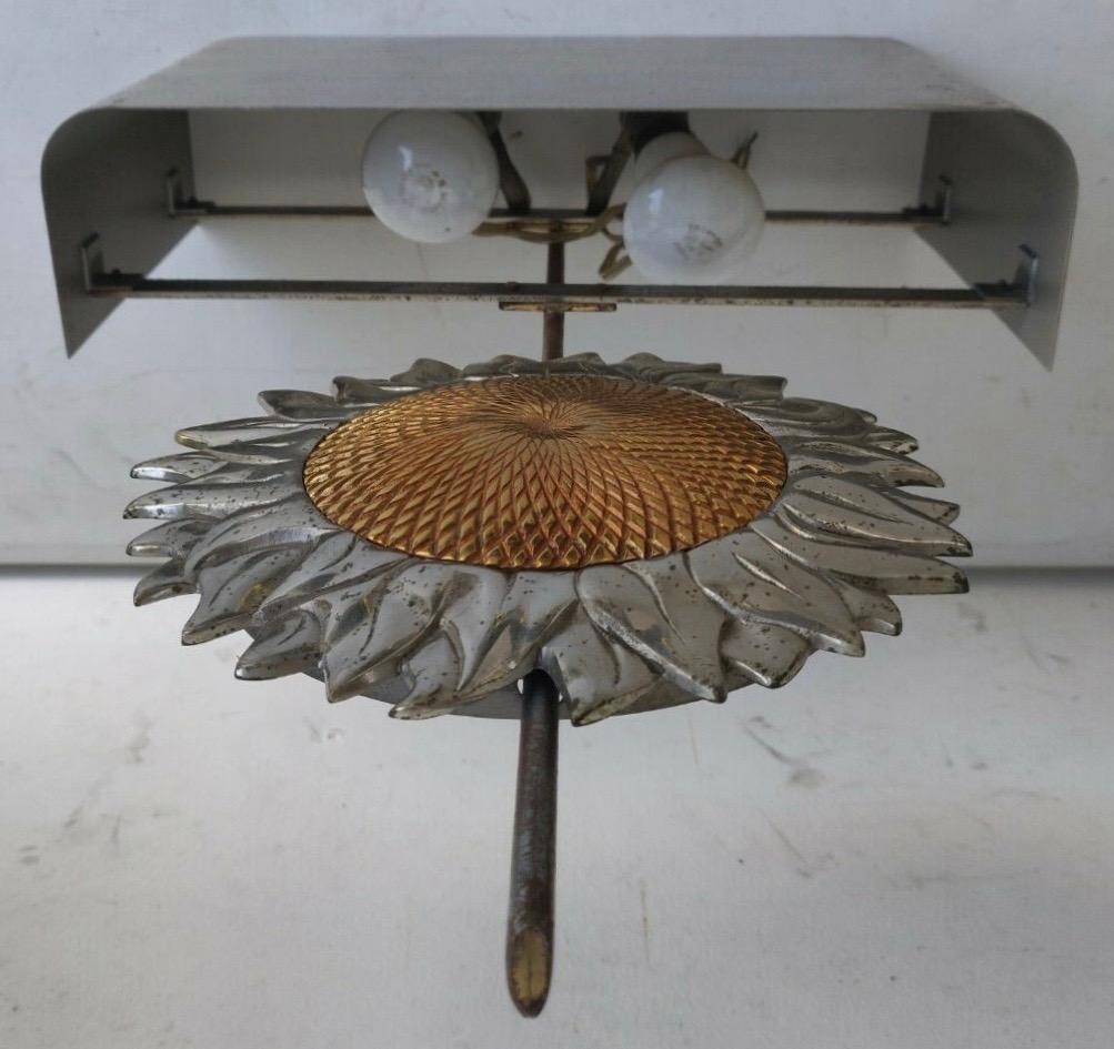 All silver with golden middle of the sunflower. Early version with French sockets.