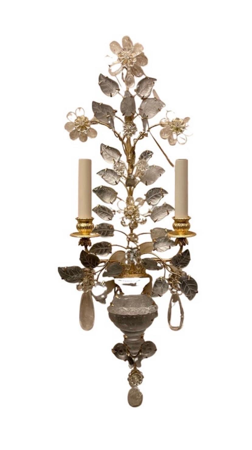 A wonderful pair of Italian rock crystal Baguès style urn and flower form sconces retailed by nestle NYC
Completely rewired with new sockets and wiring.

Two pairs available, each pair sold separately
