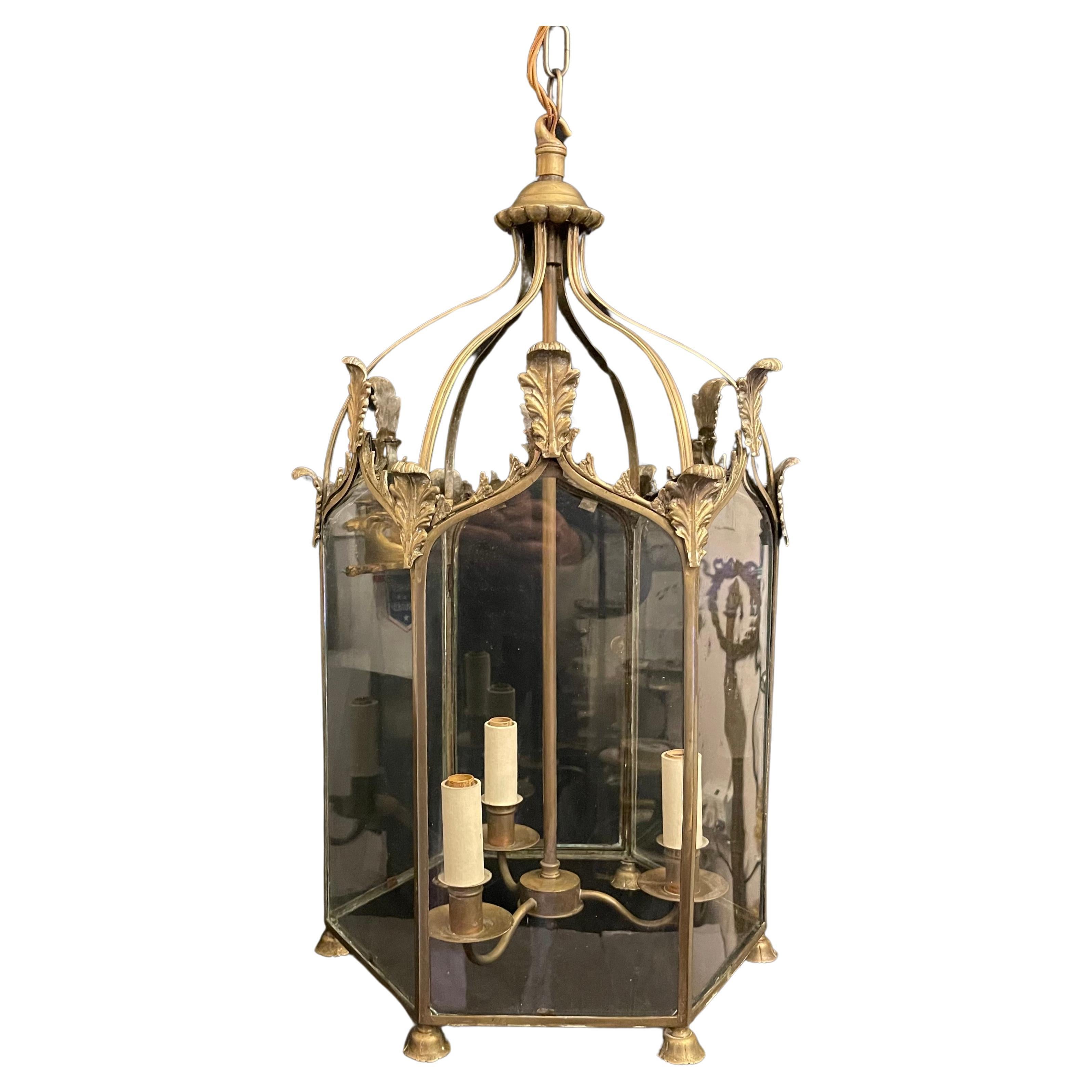 A Wonderful Vaughan lighting bronze / brass regency hall lantern, This Classic Lantern is Based On A 19th Century Six-Sided Fixture That Is Finished With Feathered Detailing And A Leaf-Like Top Coronet, With A 3 Light Cluster Inside, Accompanied By