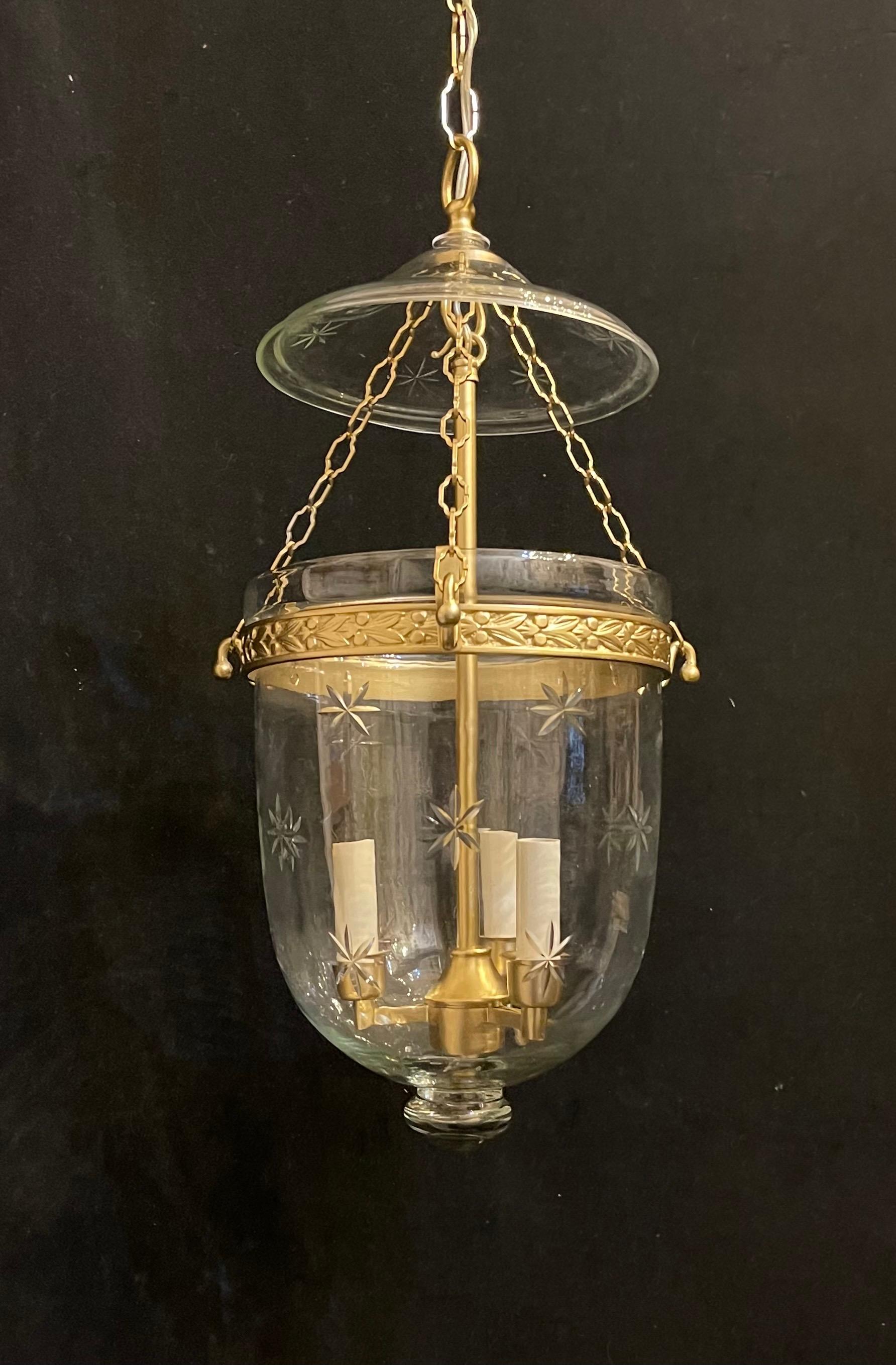A Wonderful Vaughan Designs Bronze Blown Glass With Etched Stars Bell Jar Lanterns With A 3 Candelabra Light Cluster Ceiling Fixture, Accompanied By Chain, Canopy And Mounting Hardware.

4 Of Them Available
Each Sold Separately 