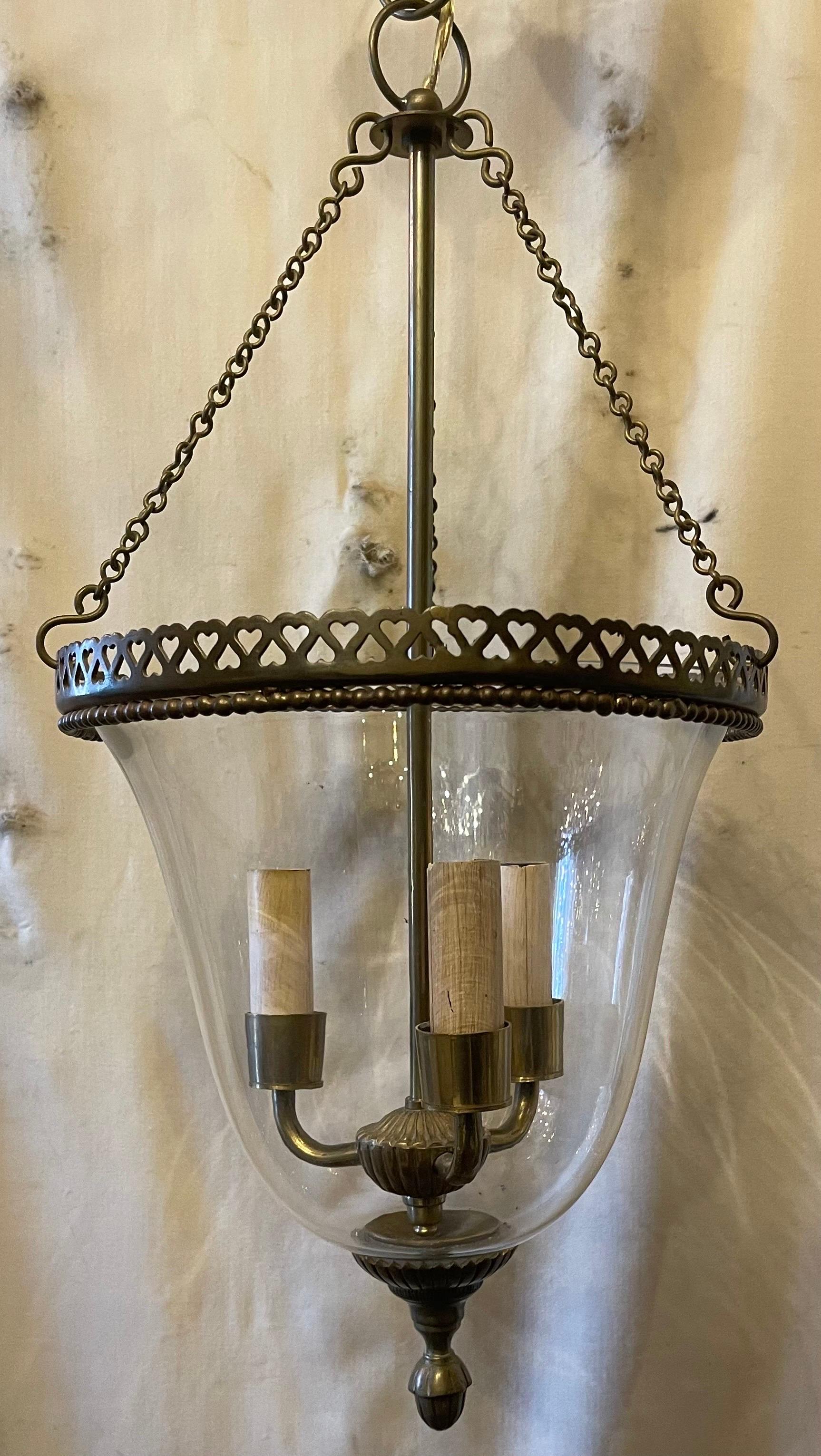 A wonderful Vaughan design style lighting bronze pierced open heart gallery glass bell jar lantern fixture in the neoclassical style, accompanied by chain canopy and mounting hardware.
Fitted with 3 candelabra sockets.
 