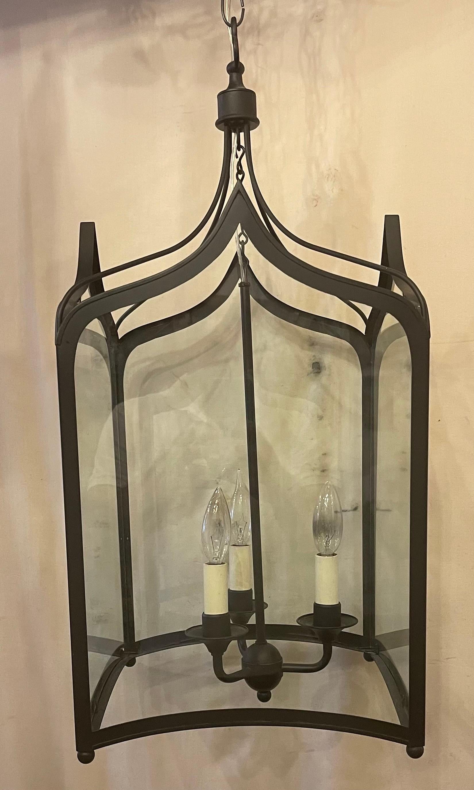 A Wonderful Set Of 3 Vaughan Lighting Regency Square With Arched Top And Bottom Structure In A Matte Black Iron Each Lantern With 3 Candelabra Lights Inside, They are Accompanied By Chain Canopy And Mounting Hardware
They Are UL Listed And Ready To