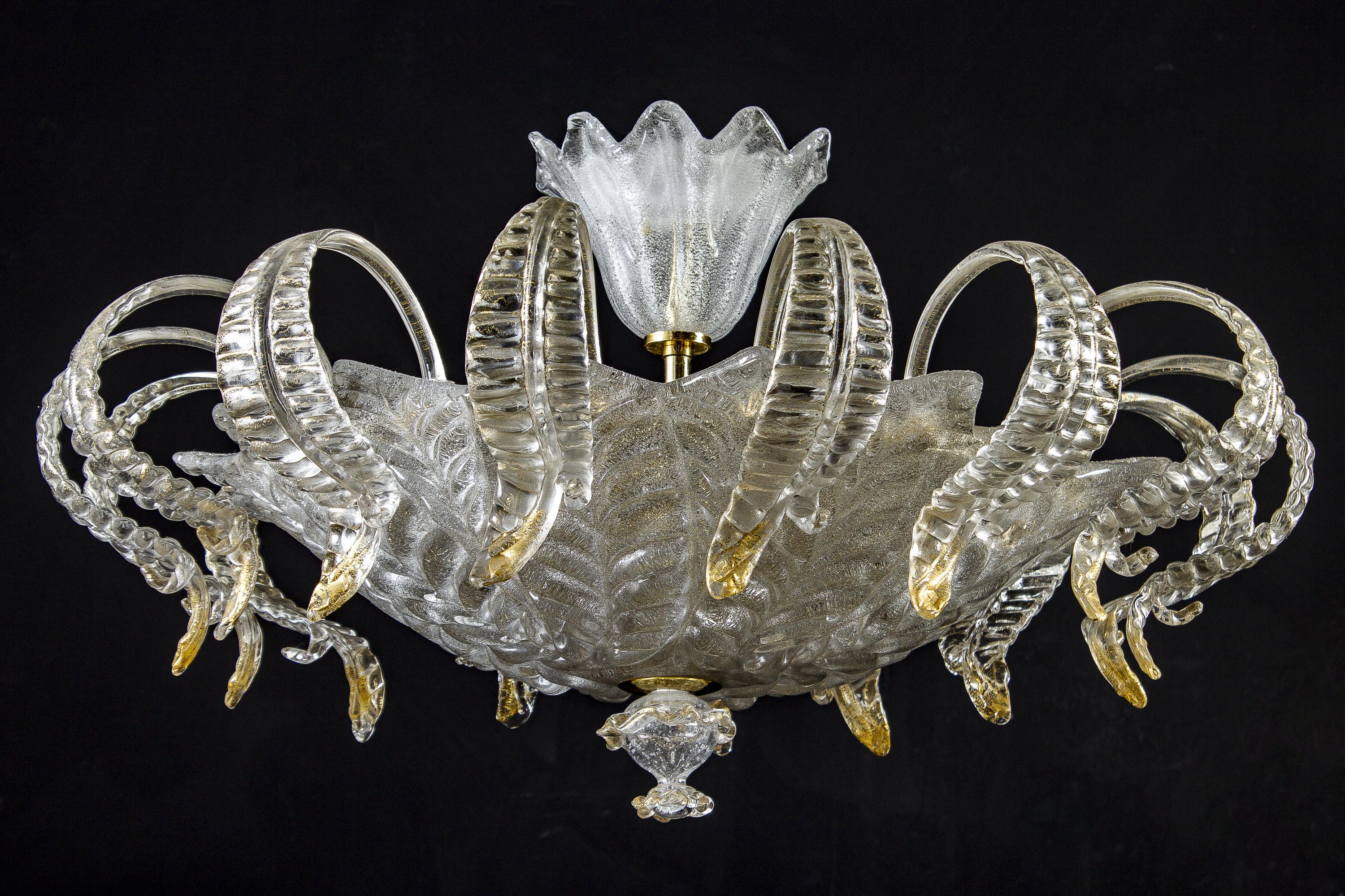 This amazing and rare chandelier centered with a precious hand blown cup, surrounded by a Cascade leaves with gold intrusion.
Six E 14 light bulbs.
Excellent vintage condition.