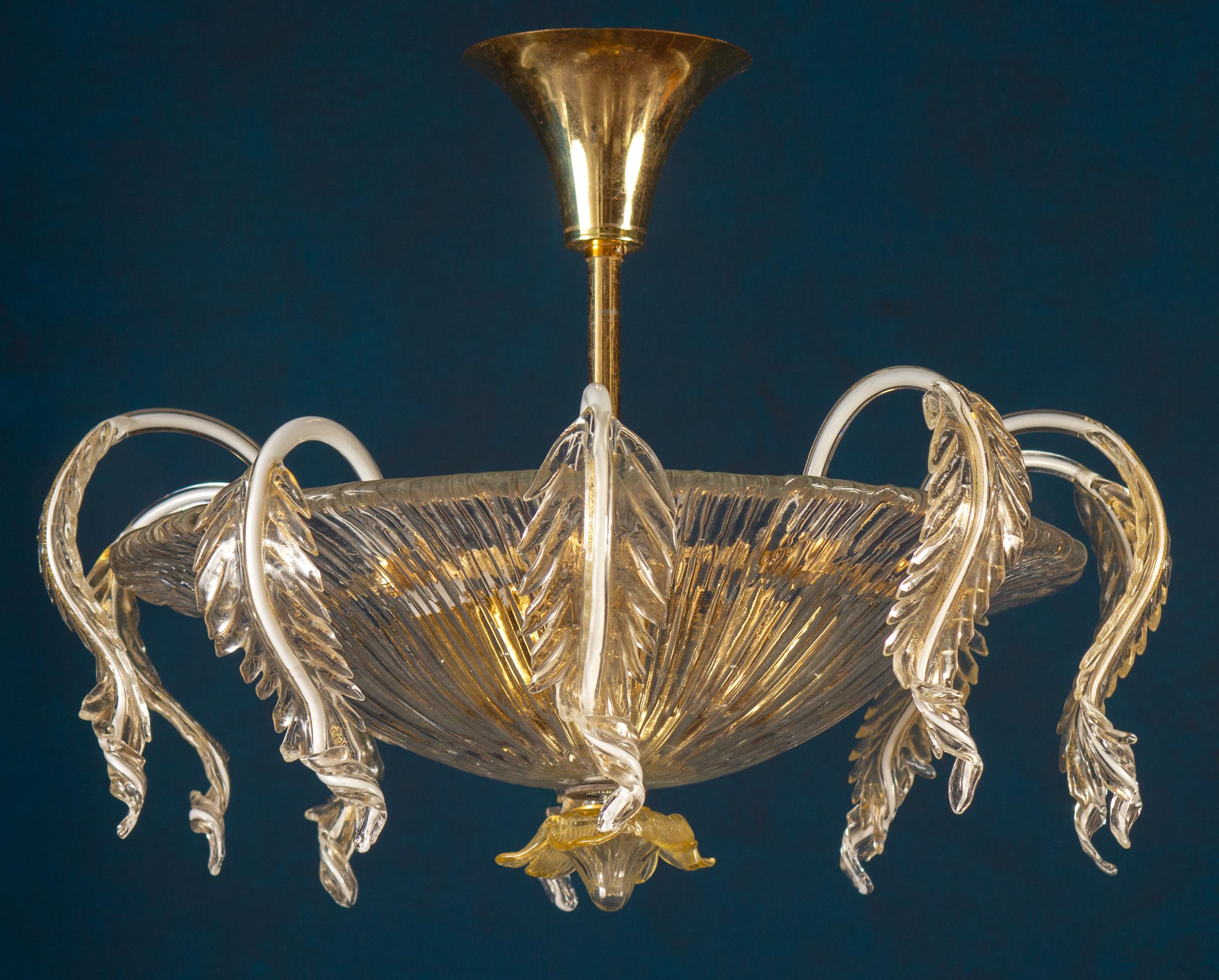 This amazing and rare chandelier centered with a precious hand blown cup, surrounded by a Cascade leaves with gold intrusion.
Three E 27 light bulbs.
Excellent vintage condition.