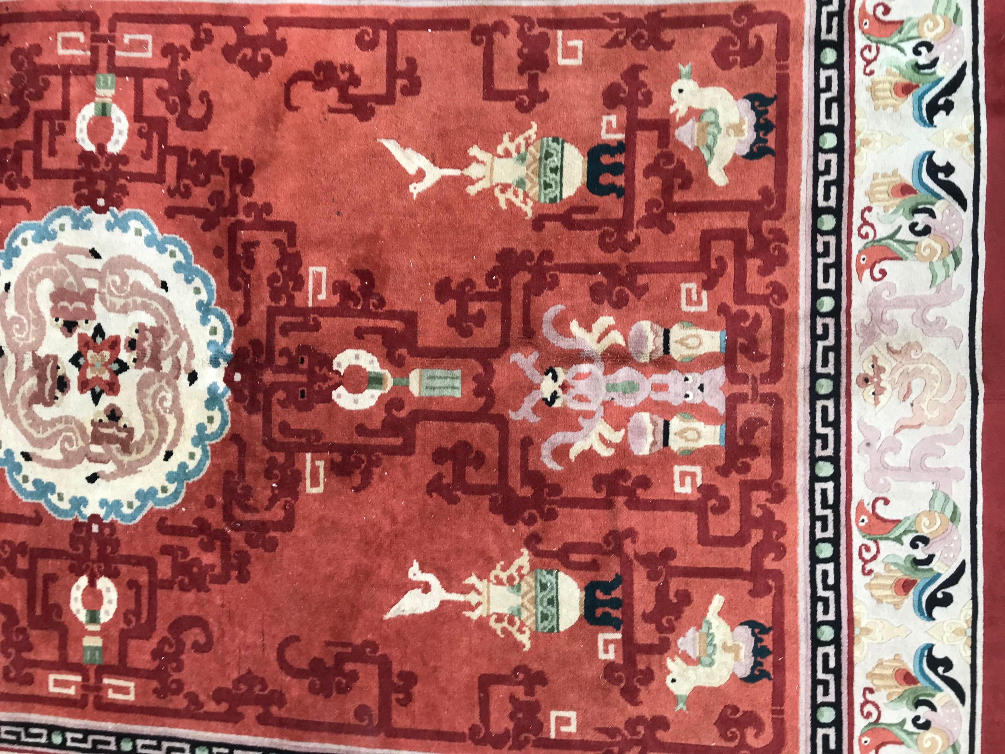 Beautiful late 20th century Chinese rug with a beautiful modern design and orange, green, blue and pink colors, entirely hand knotted with wool velvet on cotton foundation.