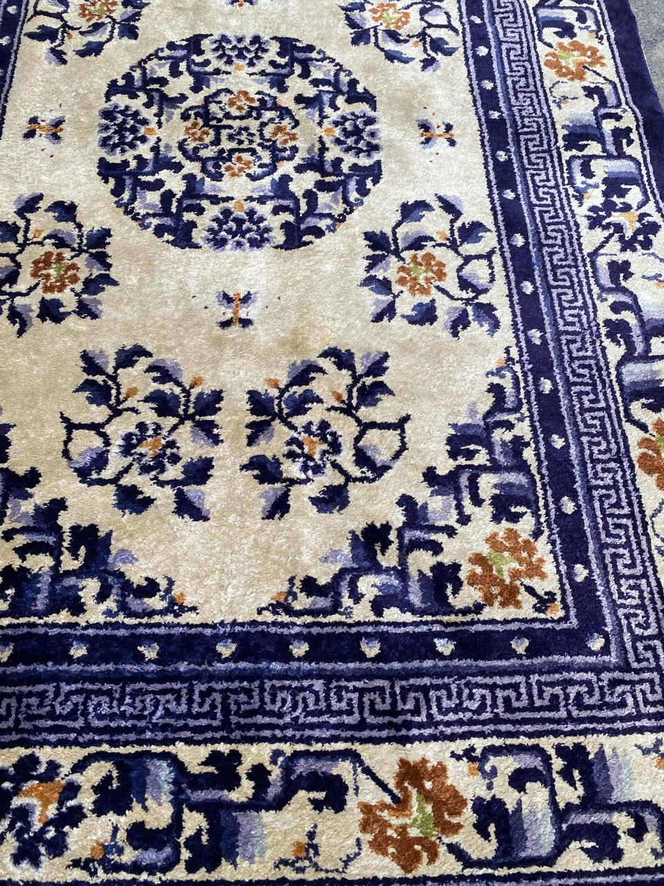 Discover the elegance of this exquisite mid-century Chinese Beijing rug featuring a stunning Chinese design in vibrant blue, brown, and touches of green on a luxurious beige background. Expertly hand-knotted with silk velvet on a silk foundation,