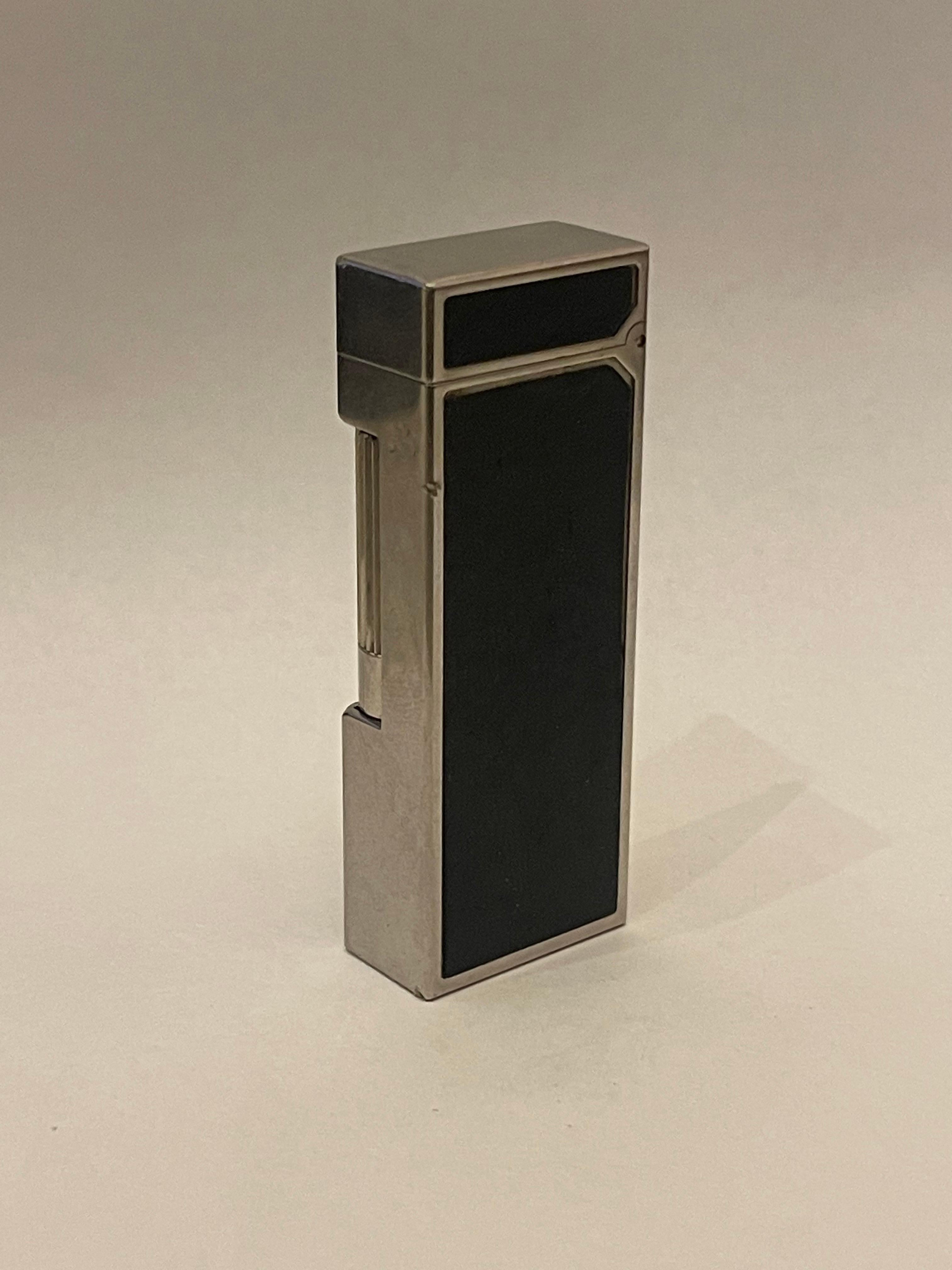 A Wonderful Vintage Dunhill Rollagas Palladium Plated Black Leather Lighter
This Lighter Is Being Sold As Is, Not Sure Of It's Working Condition...
Please Look At Pictures, It Is In Good Used Condition.
Monogram Of KEN On Top

There is perhaps no