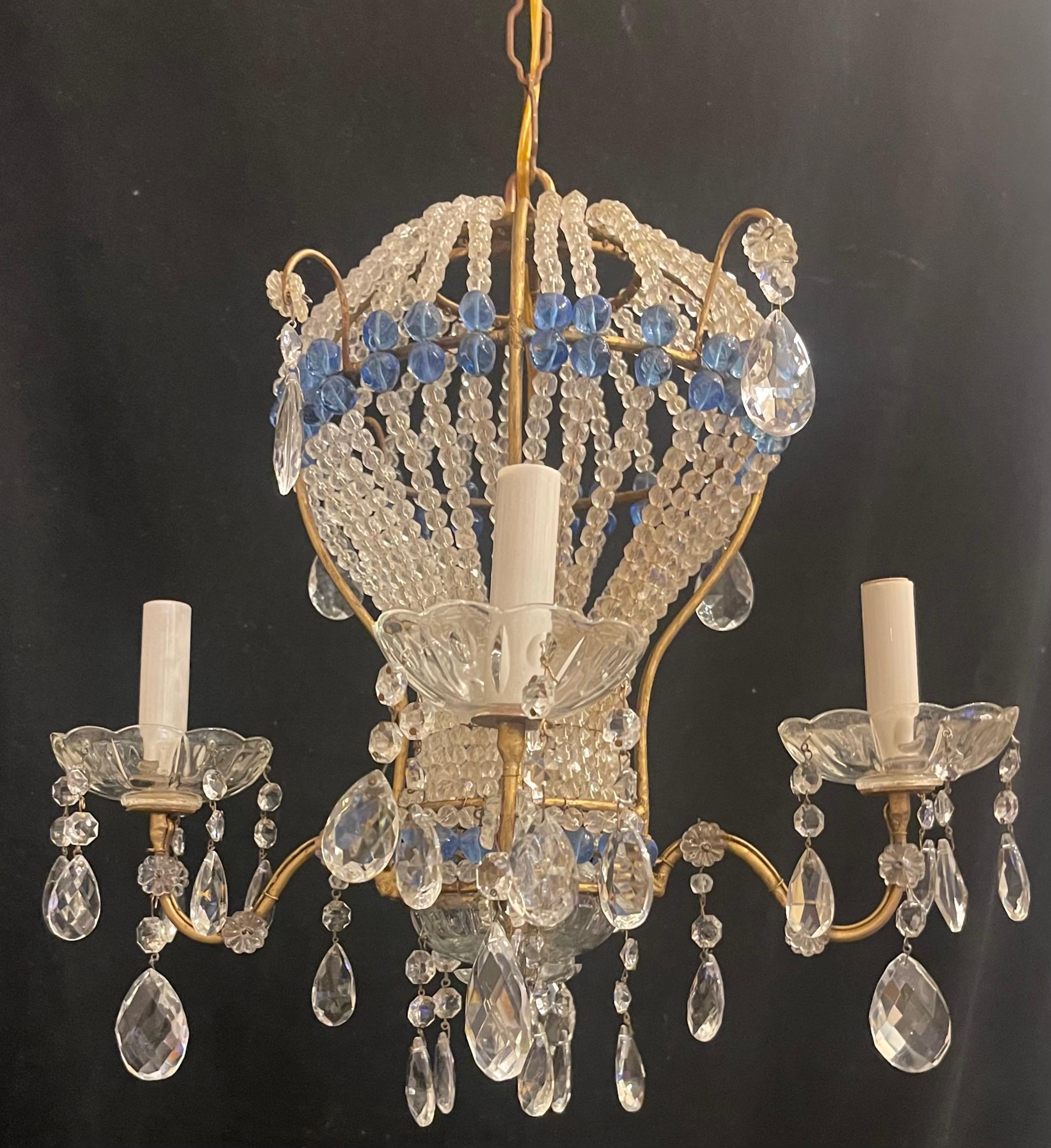 A wonderful vintage Italian gold gilt and beaded crystal with blue inset crystal beads hot air balloon chandelier, light fixture adorned with cut crystal drops throughout. Completely redone and comes ready to install with chain and canopy.

Actual