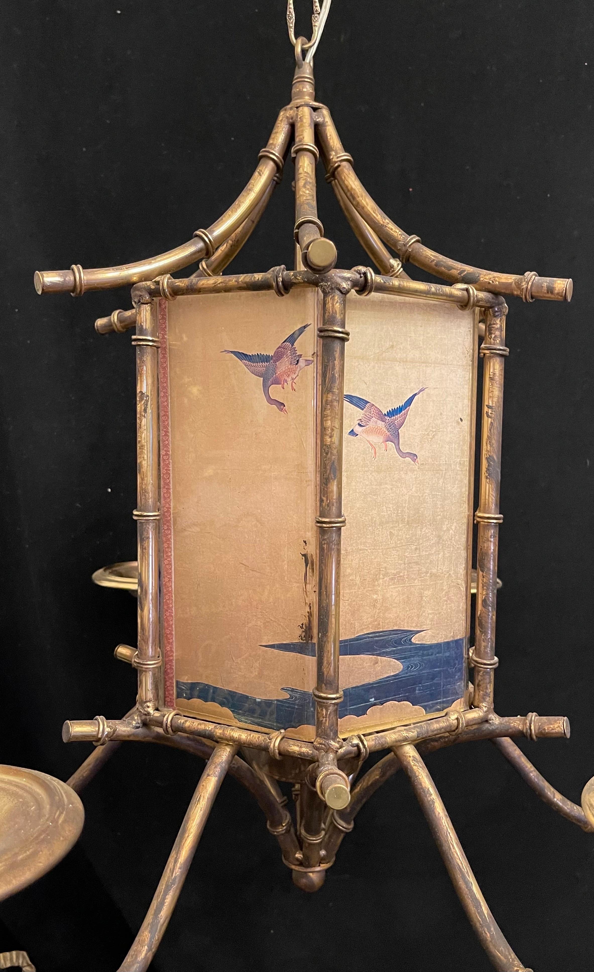 A Wonderful Vintage Large Faux Bamboo Pagoda Form Gold Gilt Tole Chinoiserie  Chandelier Having 6 Candelabra Lights And A Reverse Painted Lucite Center.