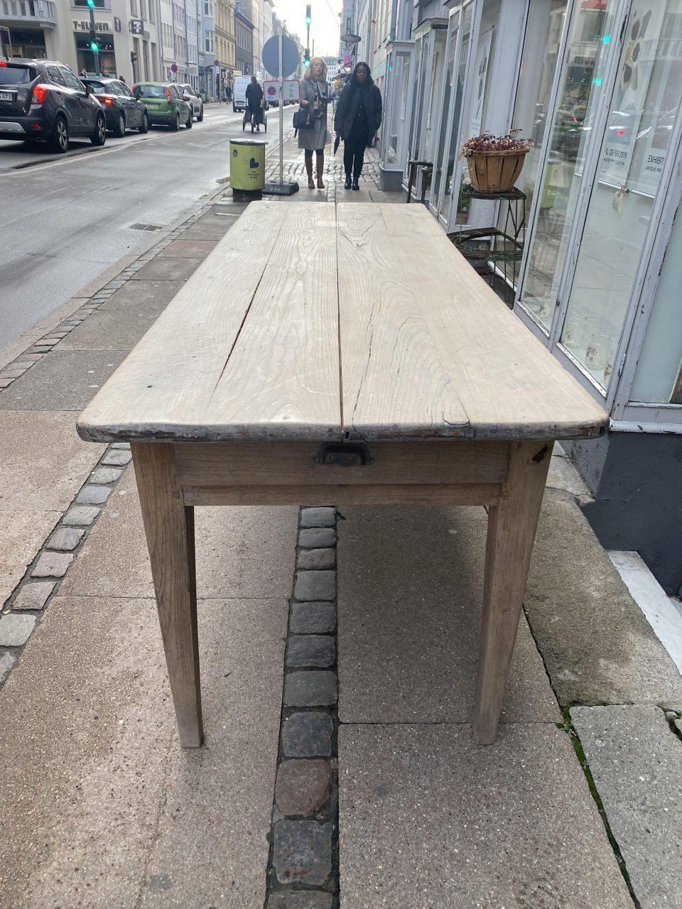 Wonderful antique French long table, in a beautiful simple profile. Stunning tapered legs, and with drawers at both ends. Notice the beautiful pale grey tone and lots of true patina. Circa 1890-1900s. Today, such a table would be ideal in a boutique