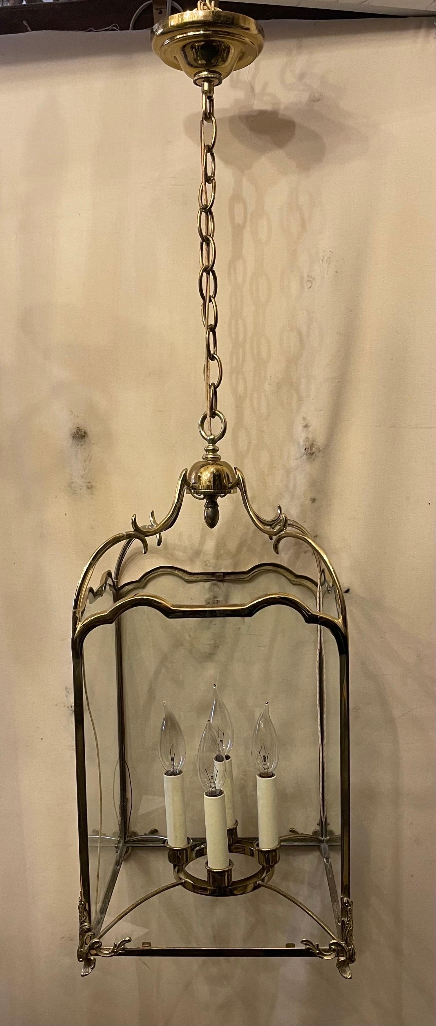 A wonderful vintage vaughan designs lighting lantern fixture in polished bronze / brass with glass panels, this square light fixture has a 4 candelabra light cluster inside and comes with chain, canopy and mounting hardware.