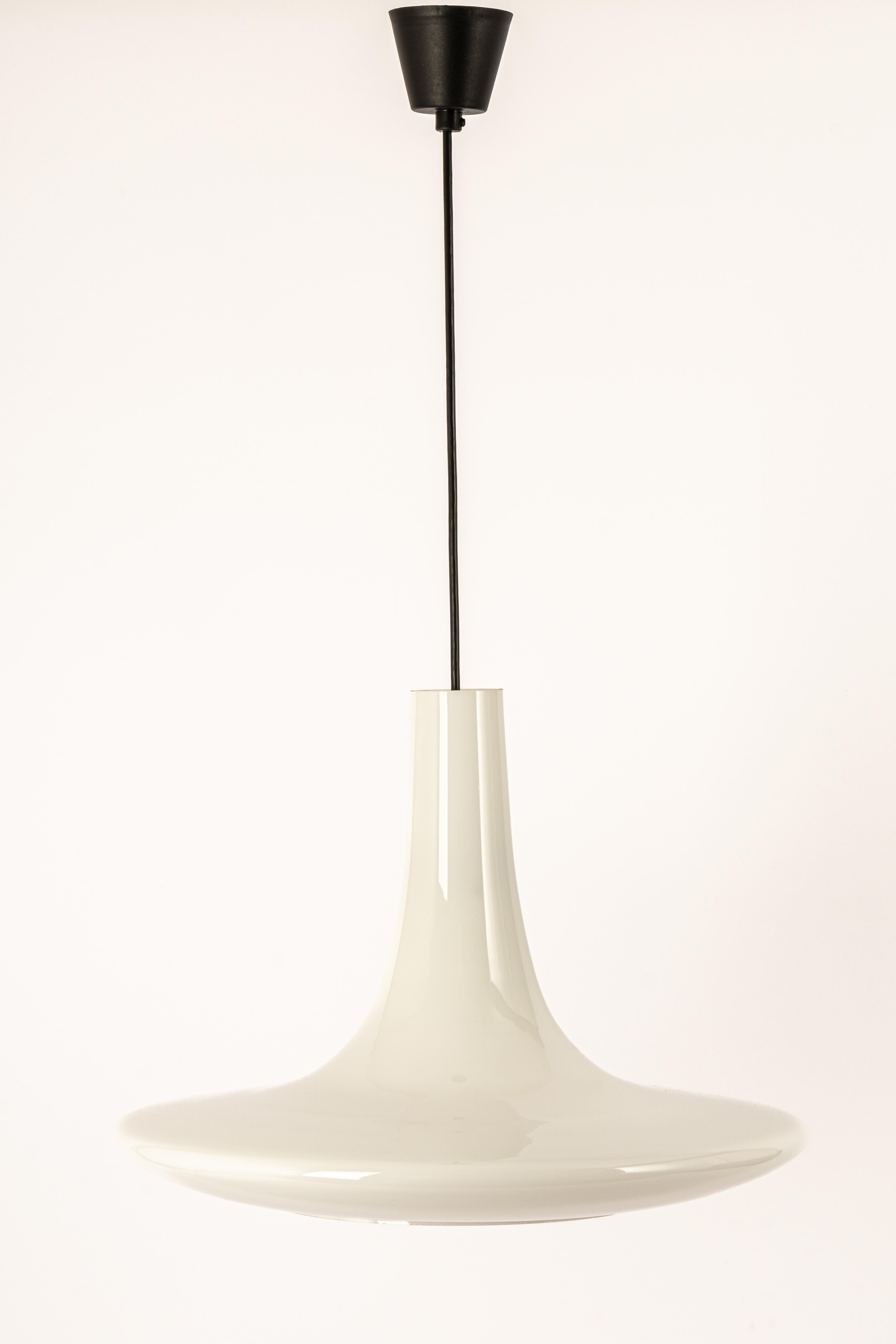 A special form of opal glass pendant designed by Koch & Lowy for Peill & Putzler, manufactured in Germany, circa 1970s.
Jade color cased on opal glass.


Sockets: One x E27 standard bulb. (150 W max).
Drop rod can be adjusted as required, free
