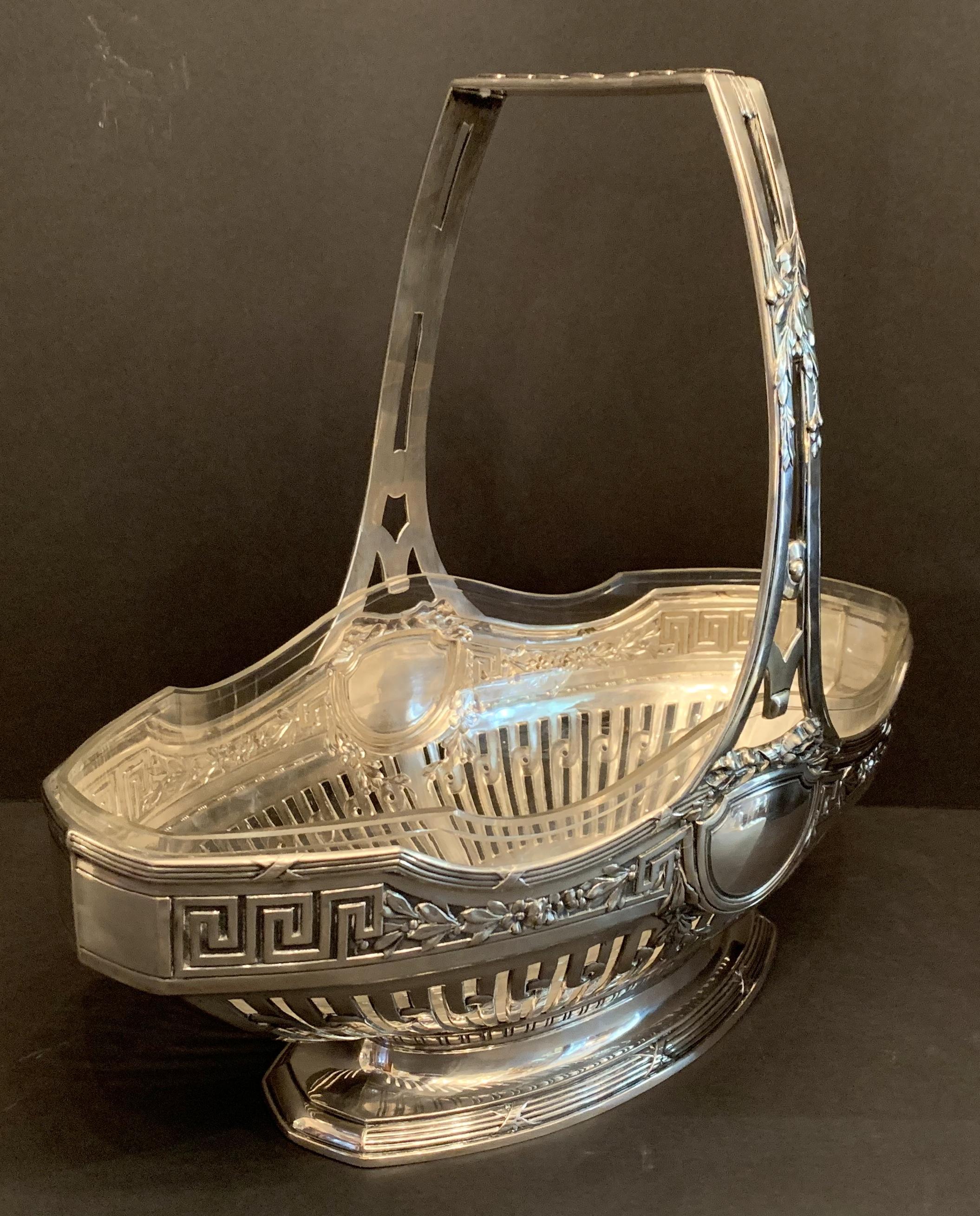 A wonderful large presentation basket with pierced work throughout and very fine details of bows, crests. By Wilhelm Binder stamped with: Moon, Crown, 800 WTB. This centerpiece was made in German using Continental 800 silver accompanied by it's